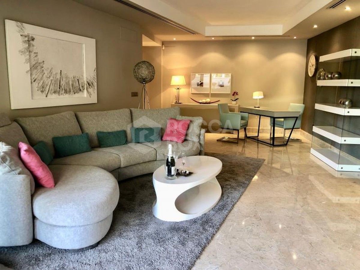 This beachside ground floor apartment in Casablanca Beach for sale