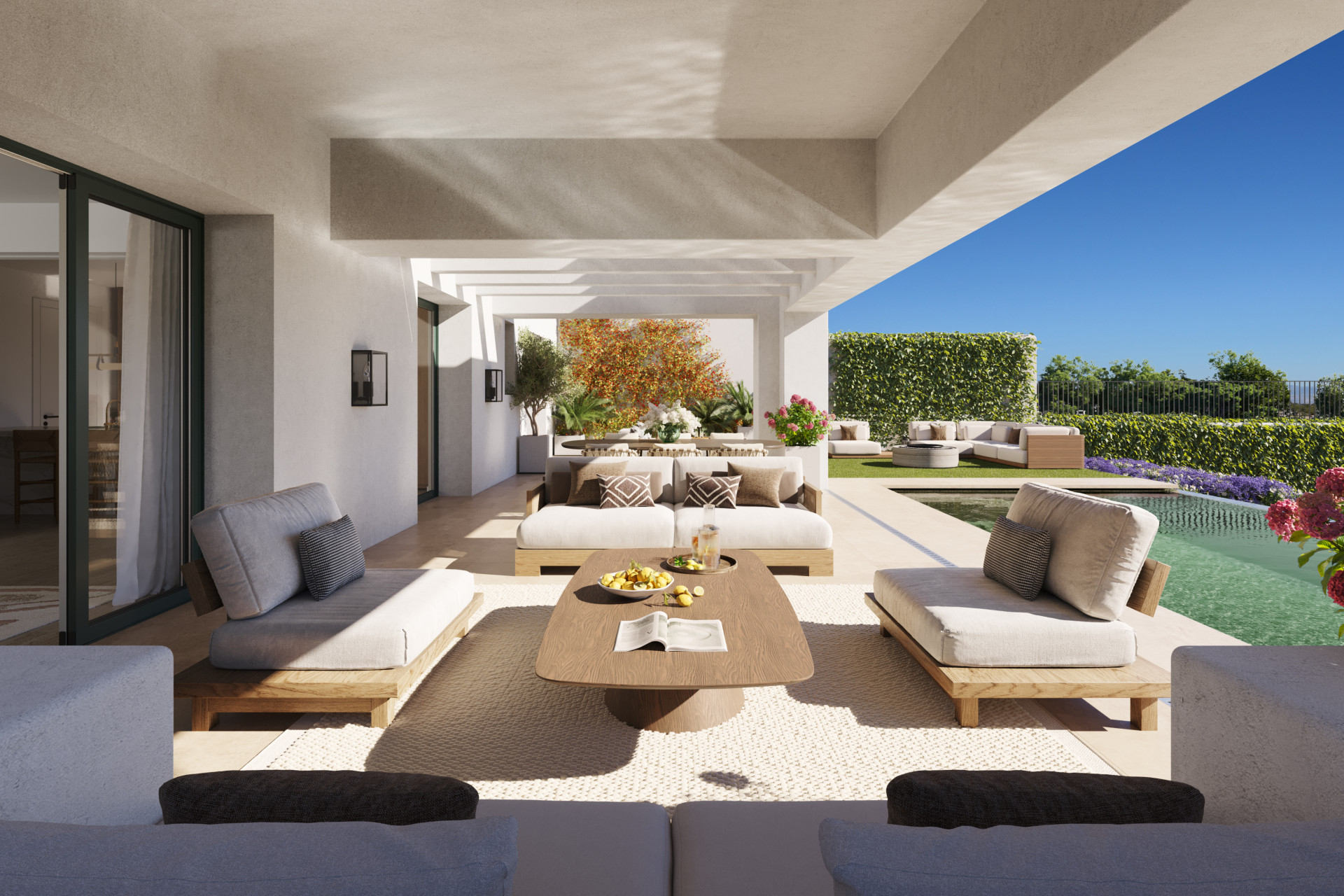Covered outdoor lounge area with sofas, coffee table, and a swimming pool, seen from a low angle.