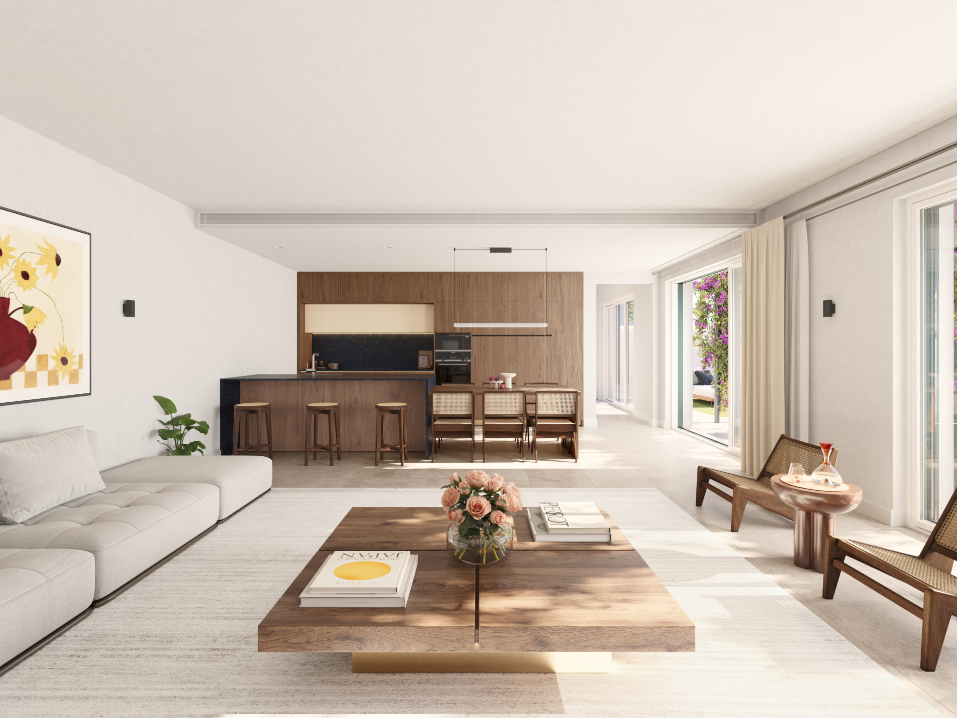 Spacious living room with a large light grey sofa, wooden coffee table, and a modern kitchen beyond.