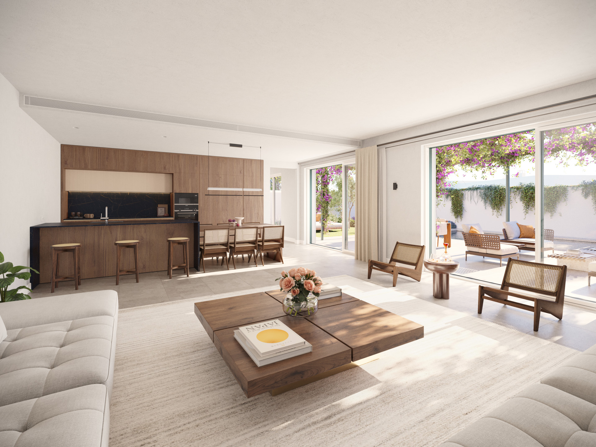 Open concept living space with a kitchen and dining area, featuring an outdoor patio view.
