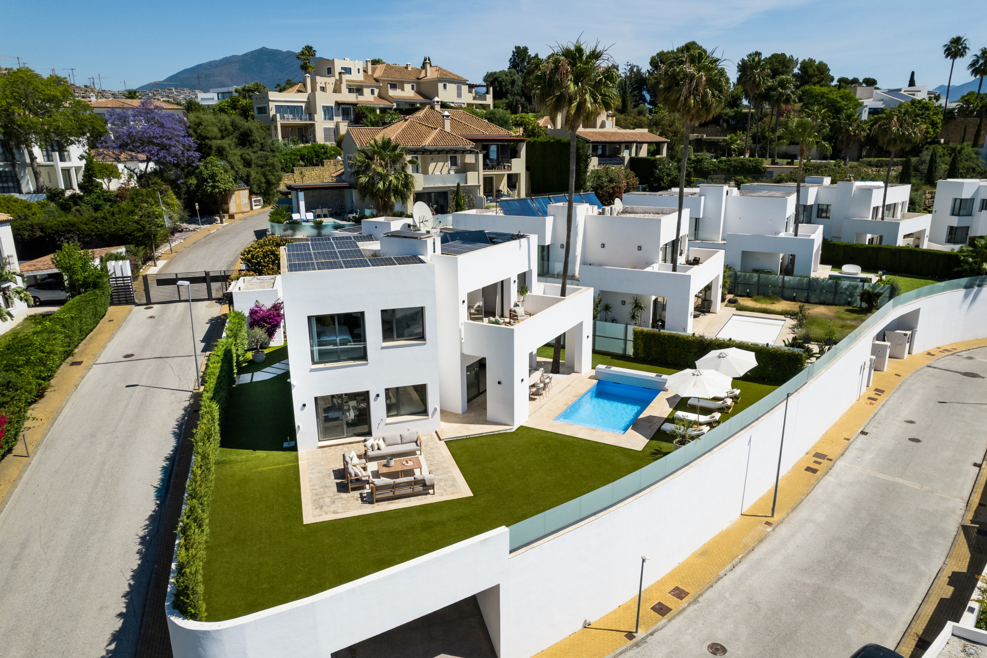 Aerial view showing the house, pool, and patio area