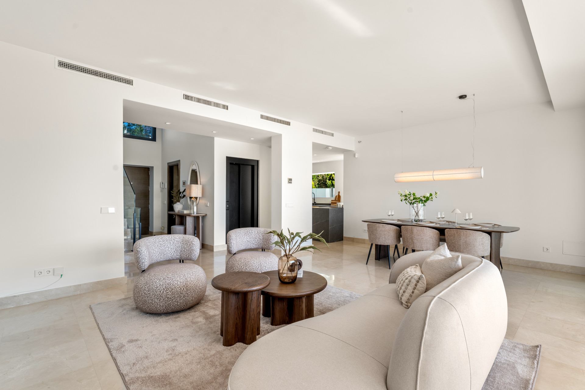 Open layout with dining space and a view of the kitchen.