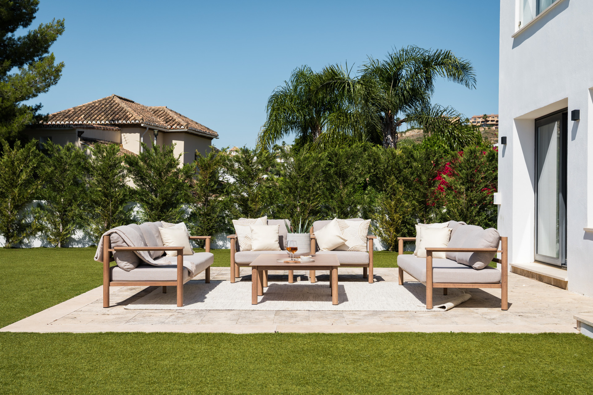 Close-up of the seating arrangement featuring cushions and a decorative table.
