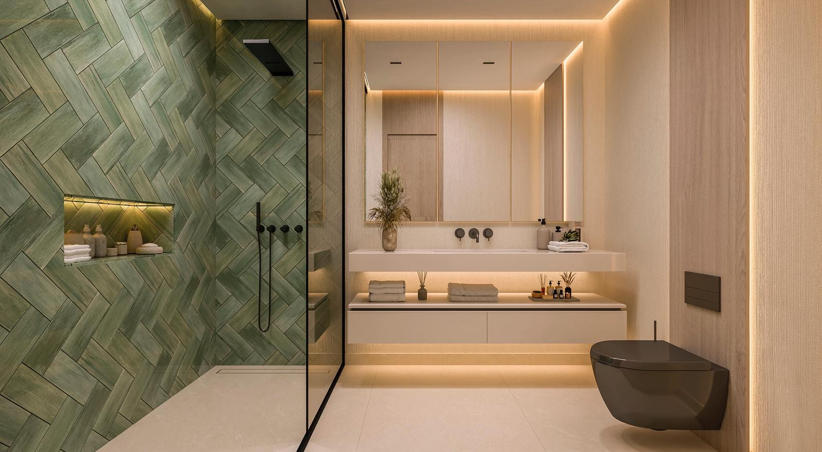 Bathroom with a large shower featuring green herringbone tile, a floating vanity with dual sinks, and a toilet.