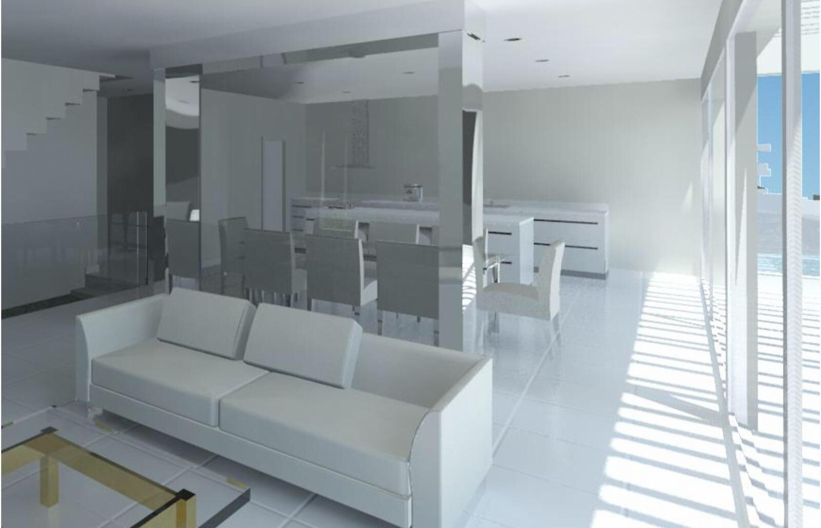 Living room interior with a white sofa, glass coffee table, and a kitchen visible in the background.