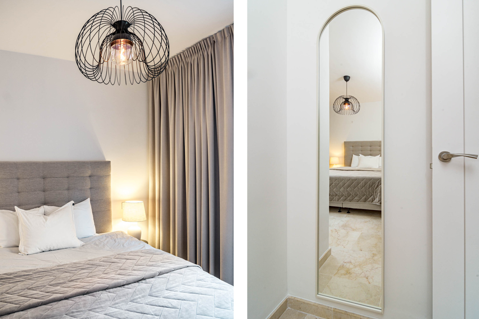 Bedroom with a bed, modern light fixture, and a tall arched mirror reflecting the room.