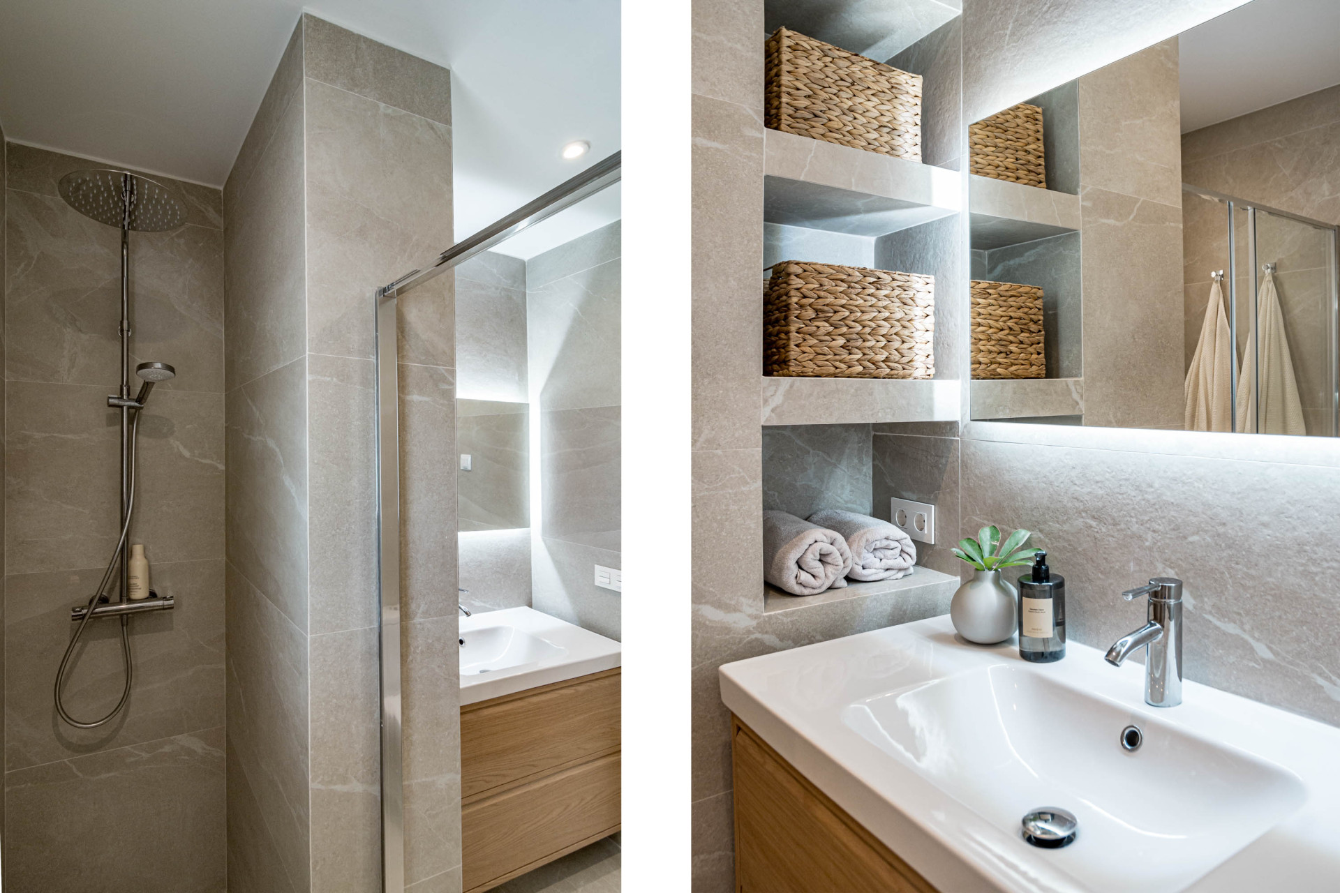 Bathroom with a rainfall shower, wood vanity, recessed shelves, and woven baskets.