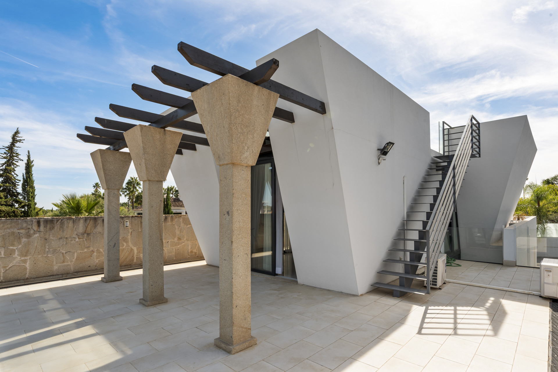 Exterior view featuring modern architecture and steps leading to upper level.