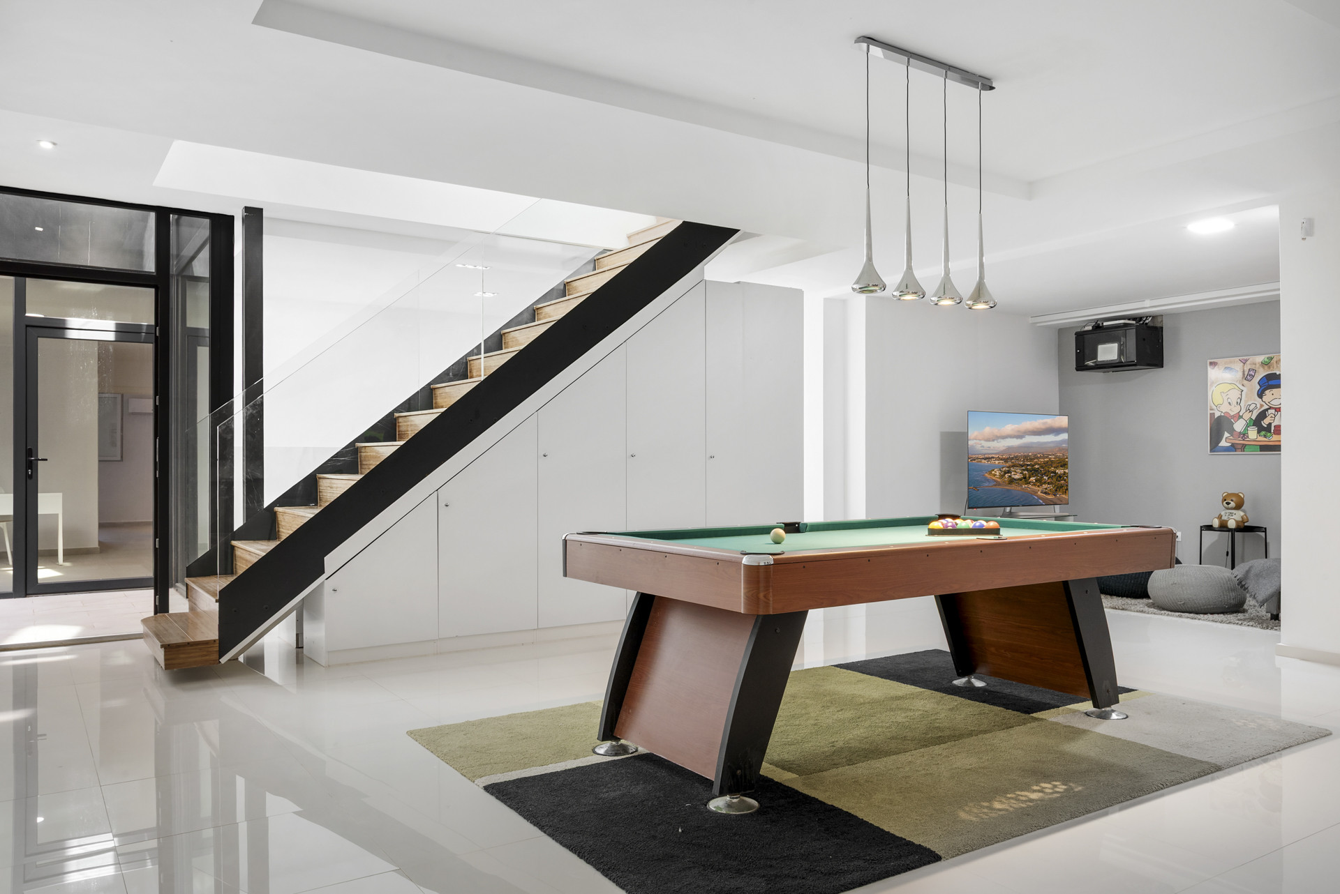 Game room featuring a pool table and modern decor.