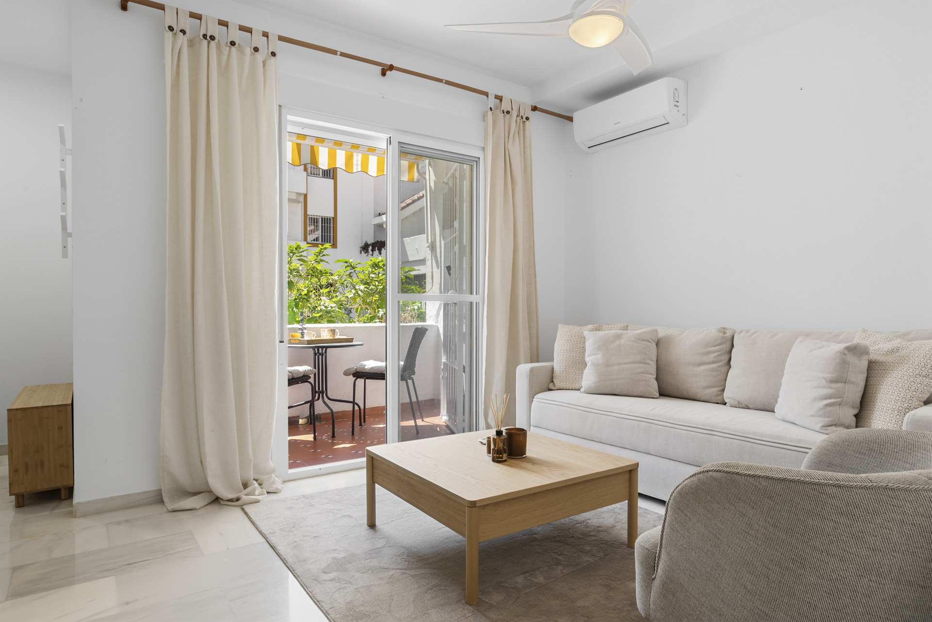 Interior view of living space with access to balcony and natural light.