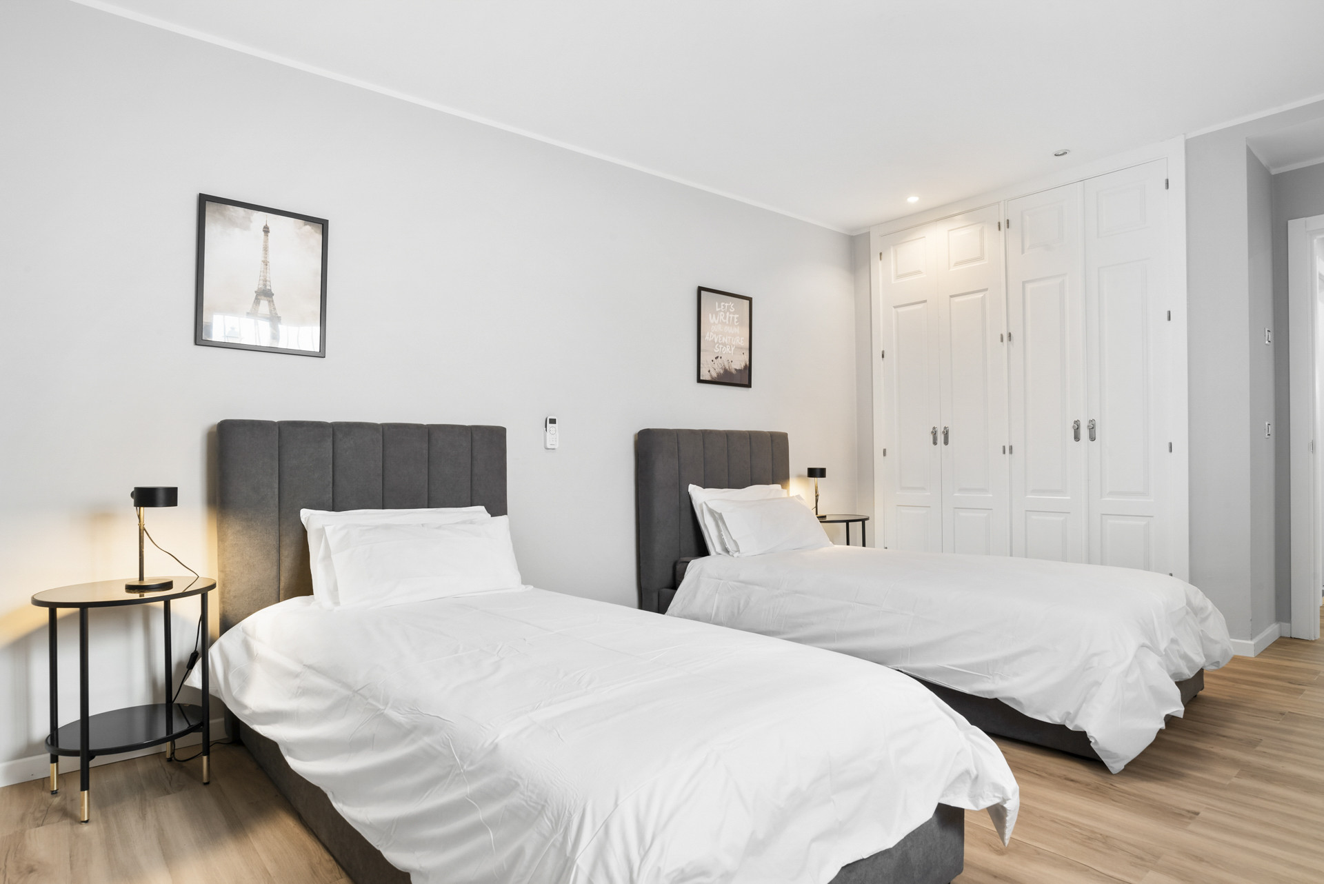 Similar view of twin bedroom with additional closet space and natural light.
