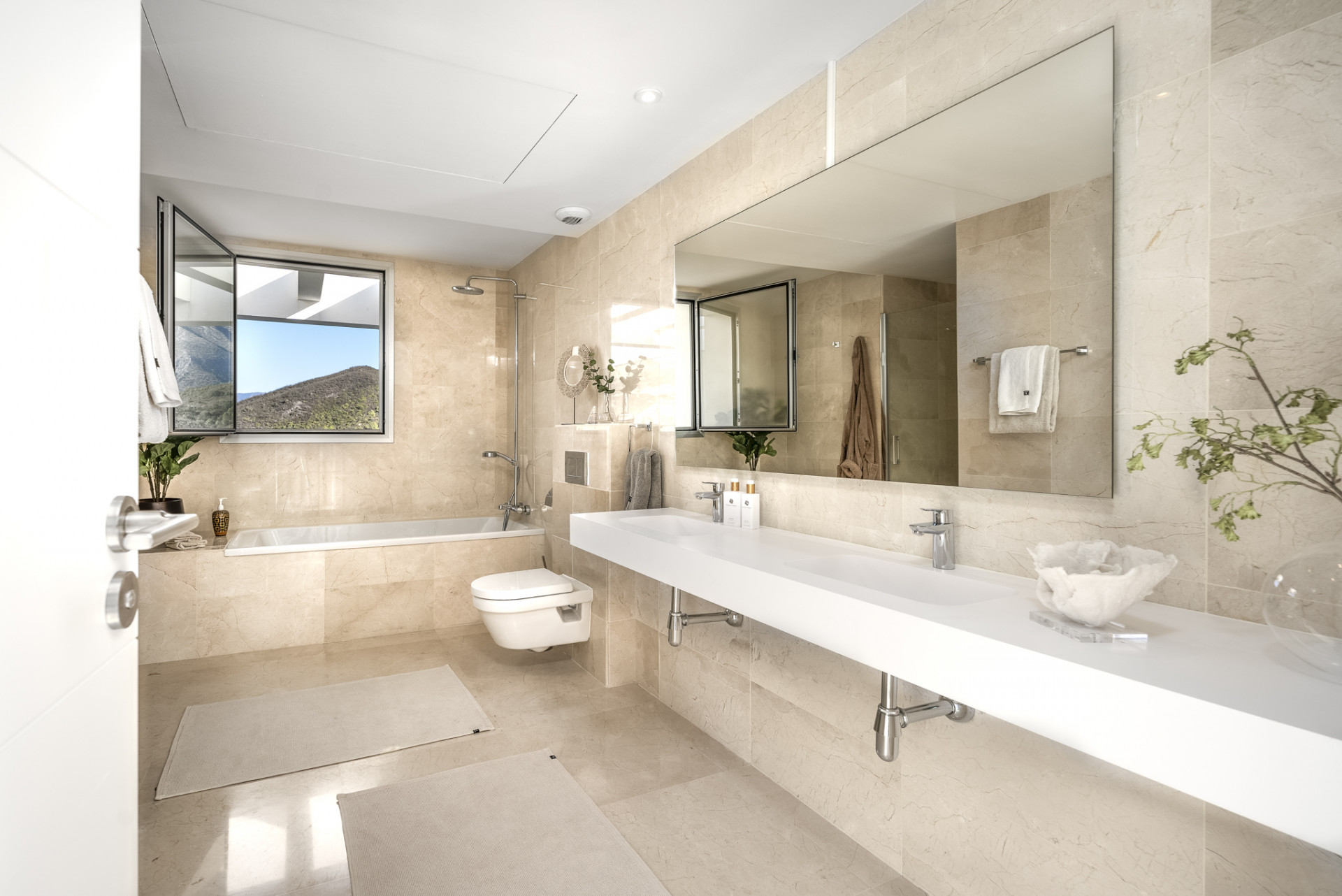 Spacious bathroom with bathtubs and large mirrors.
