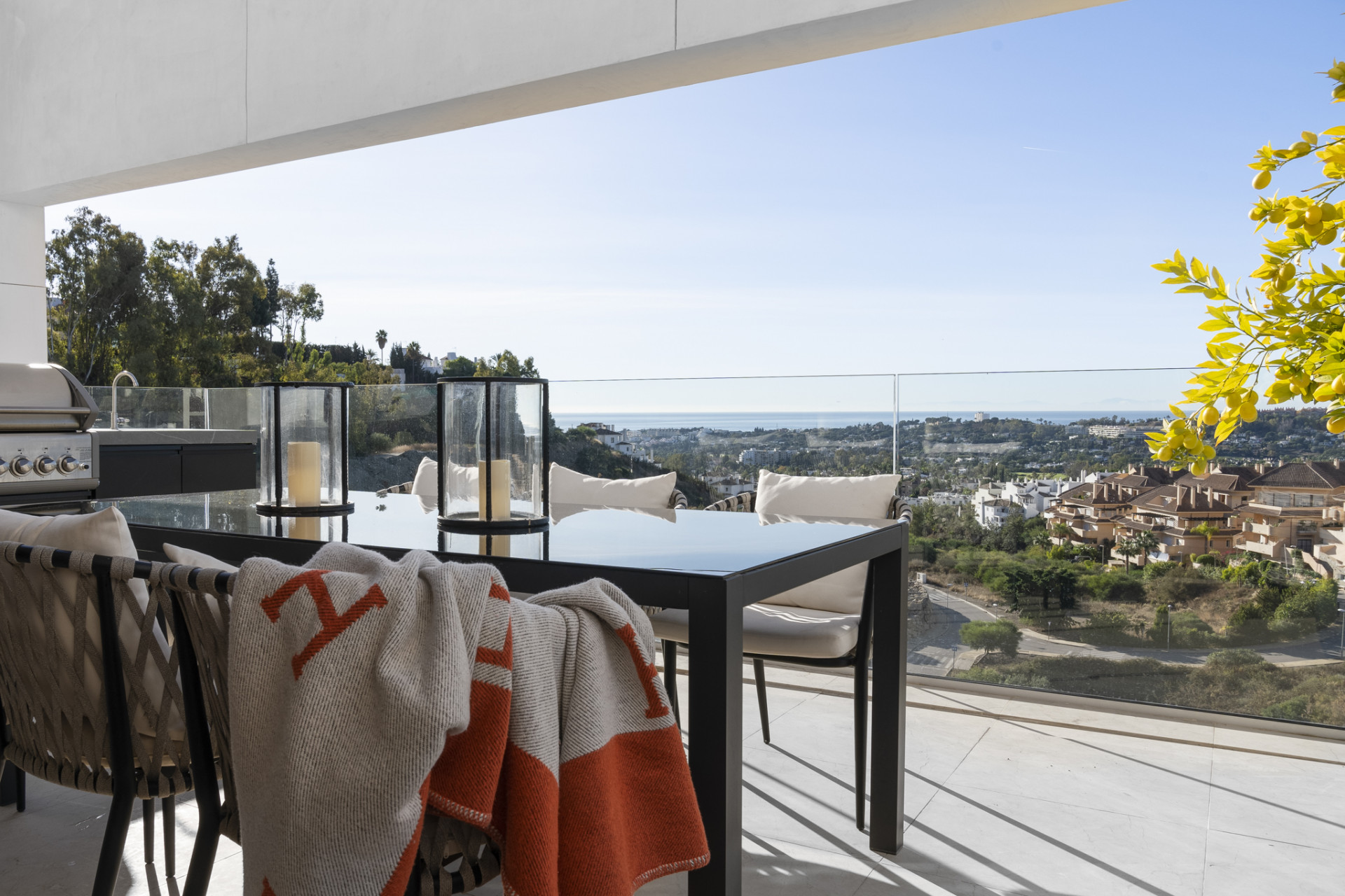 Outdoor dining area with mountains and ocean views