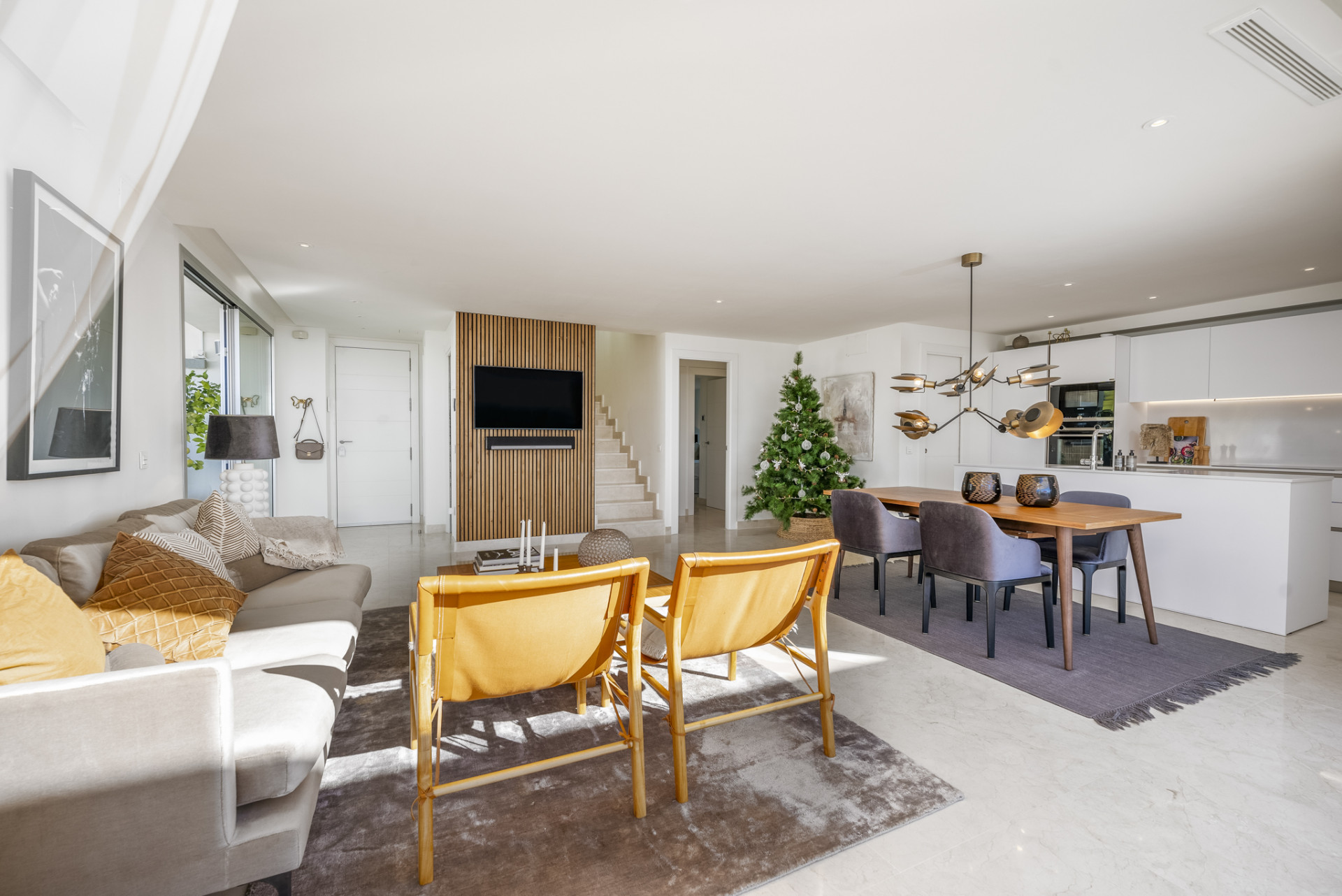 Open living area showcasing a dining table and seating