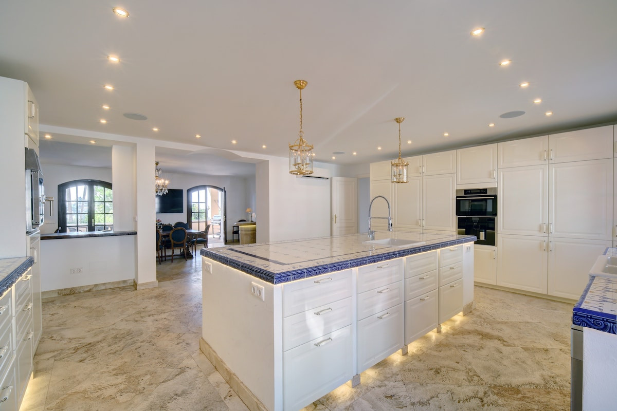 Bright kitchen with an island and modern appliances.