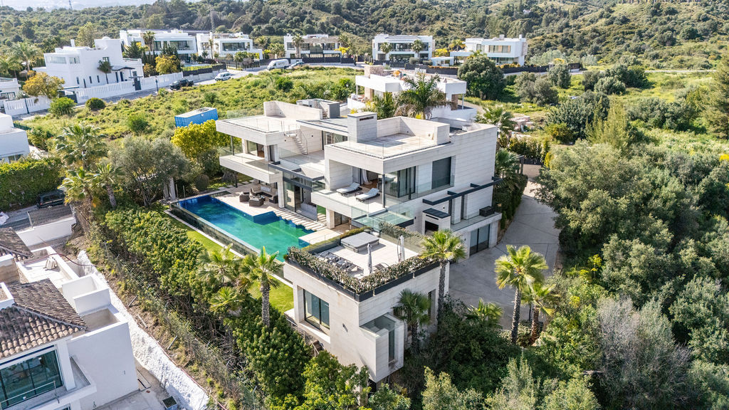 Side view featuring the swimming pool and greenery around the house.