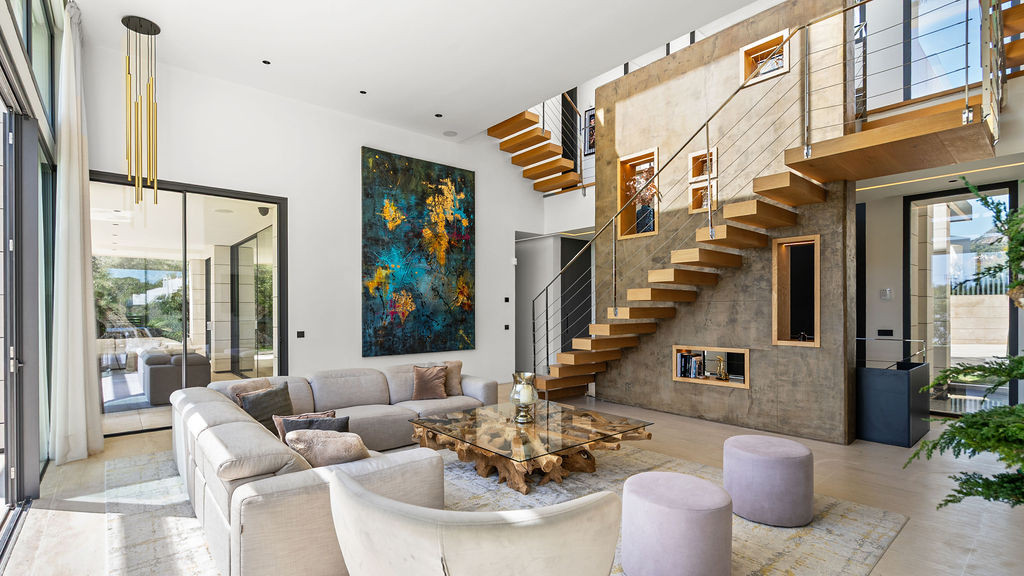 Another angle of the living area showcasing decorative elements and a colorful wall art.