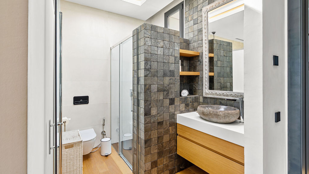 Contemporary bathroom with a walk-in shower and elegant fixtures.