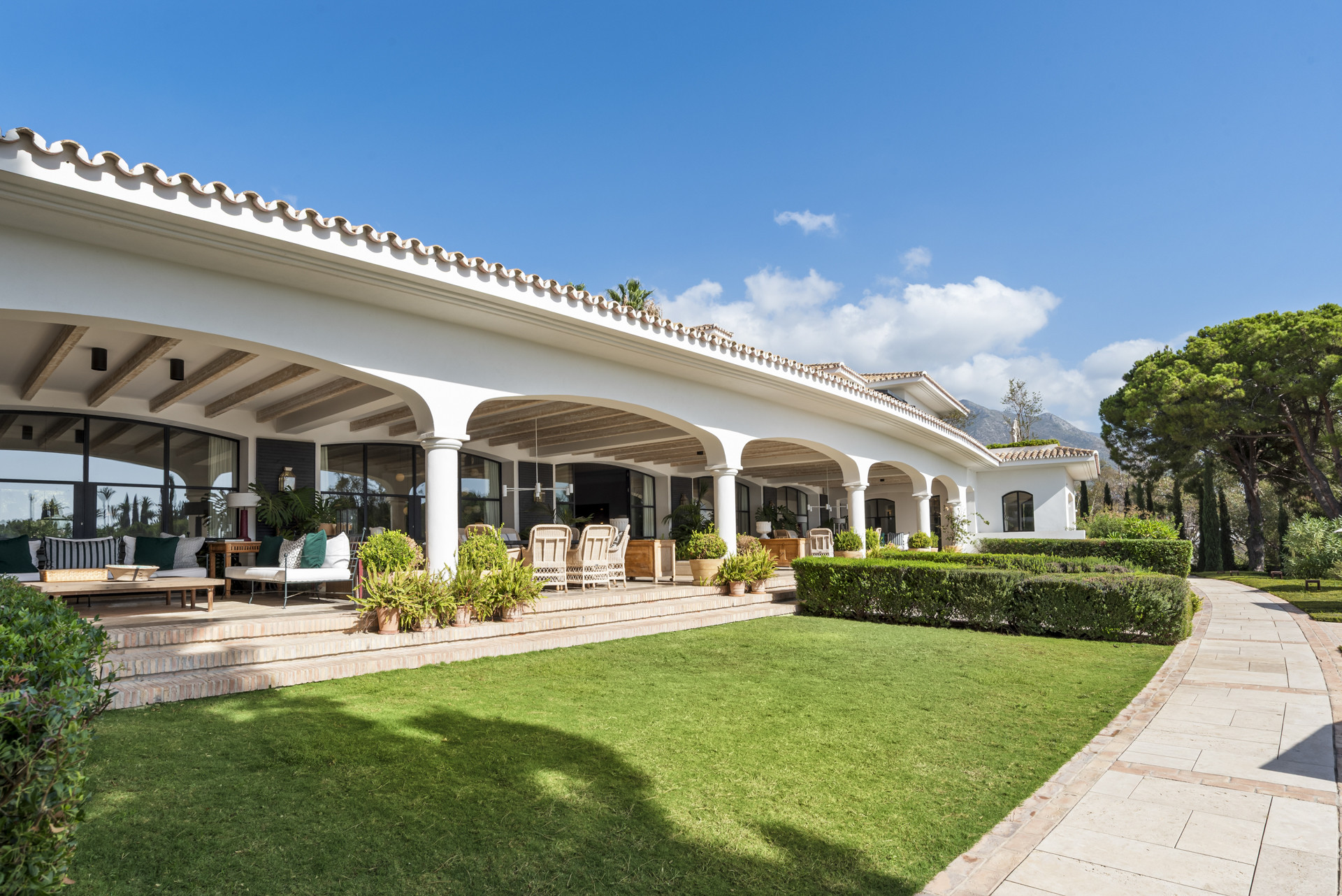 Exterior view showcasing the house facade and surrounding greenery.