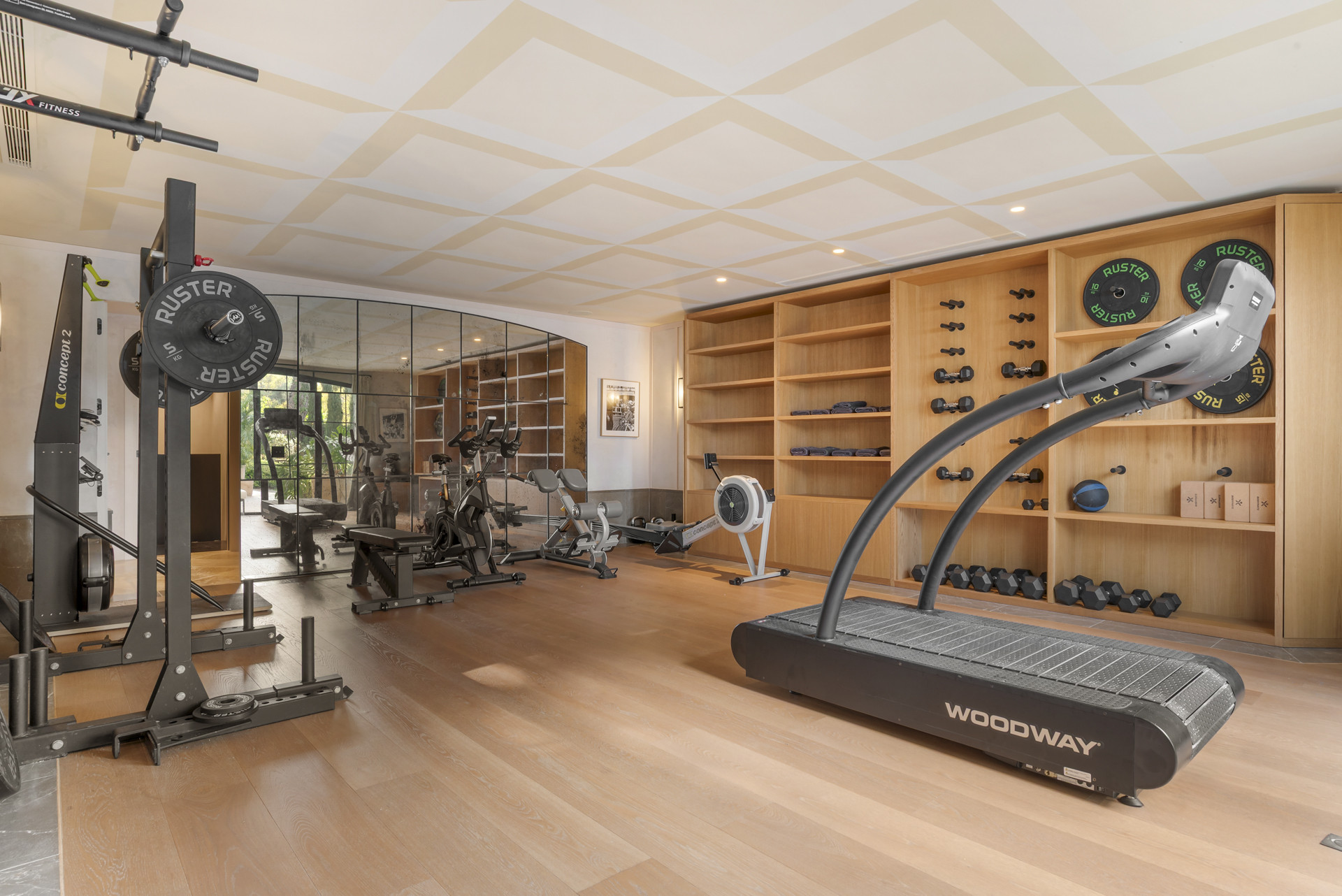 Home gym featuring workout equipment and wall mirrors.