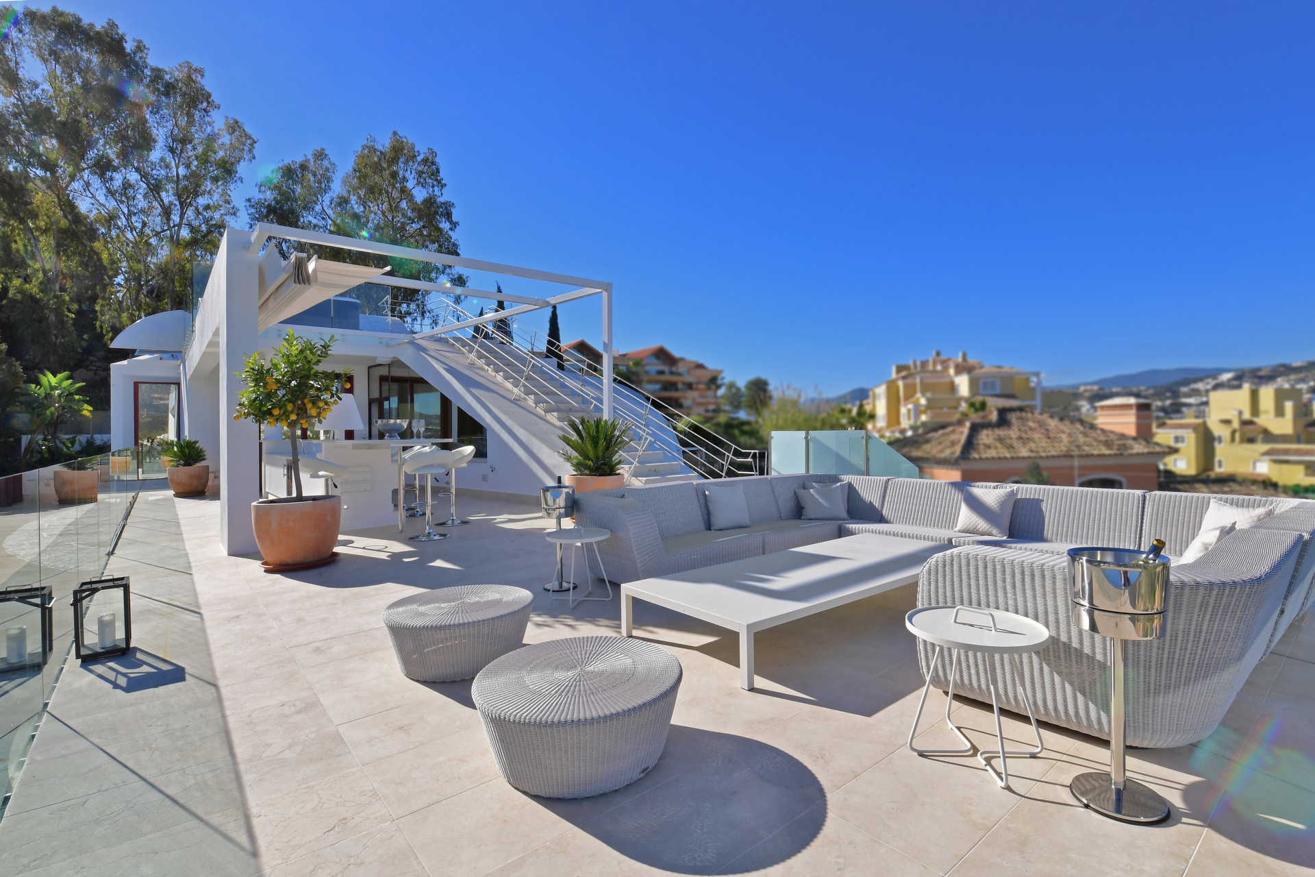 Lounge area with modern furniture and plants on a terrace
