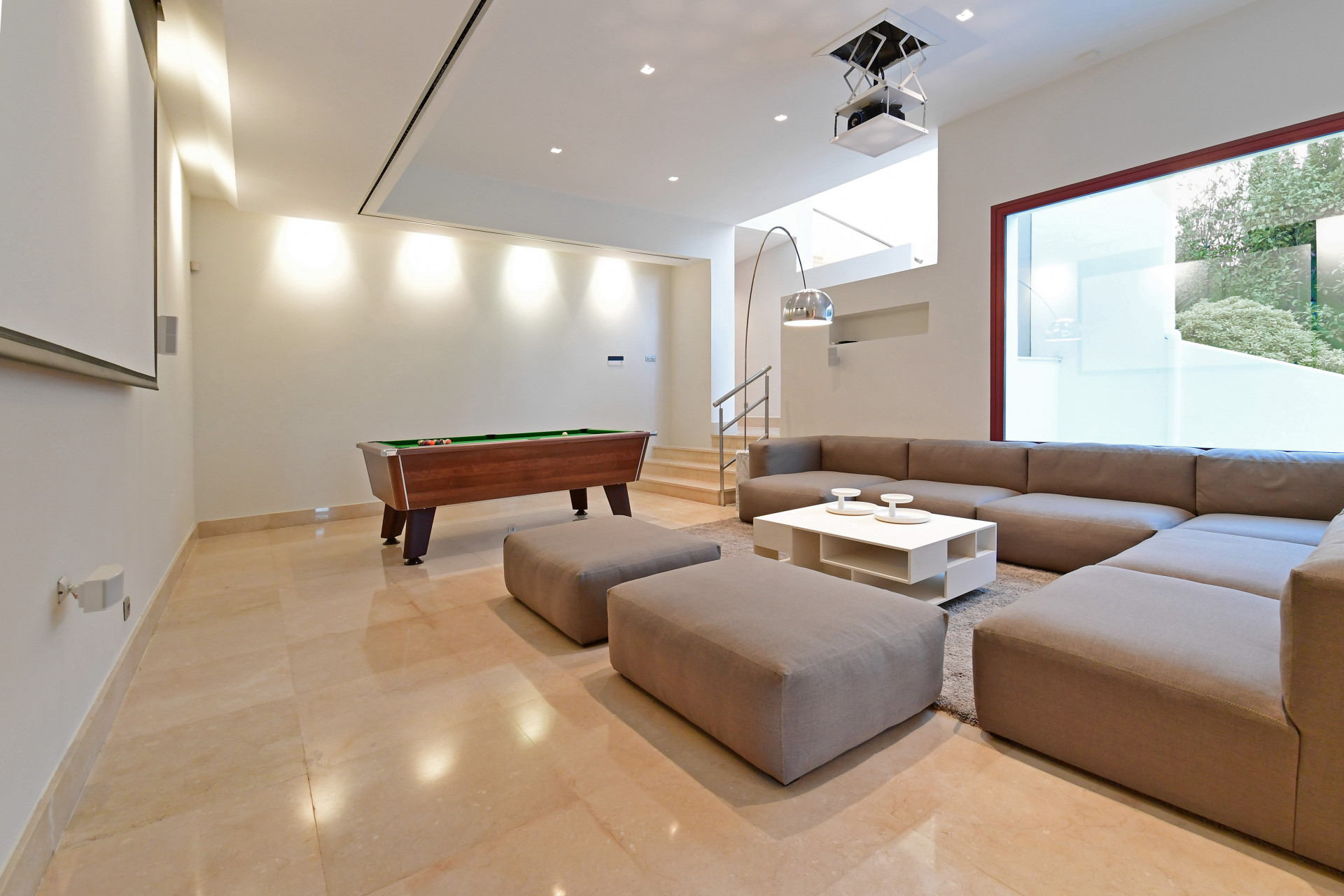 Game room featuring a pool table and large sectional sofa
