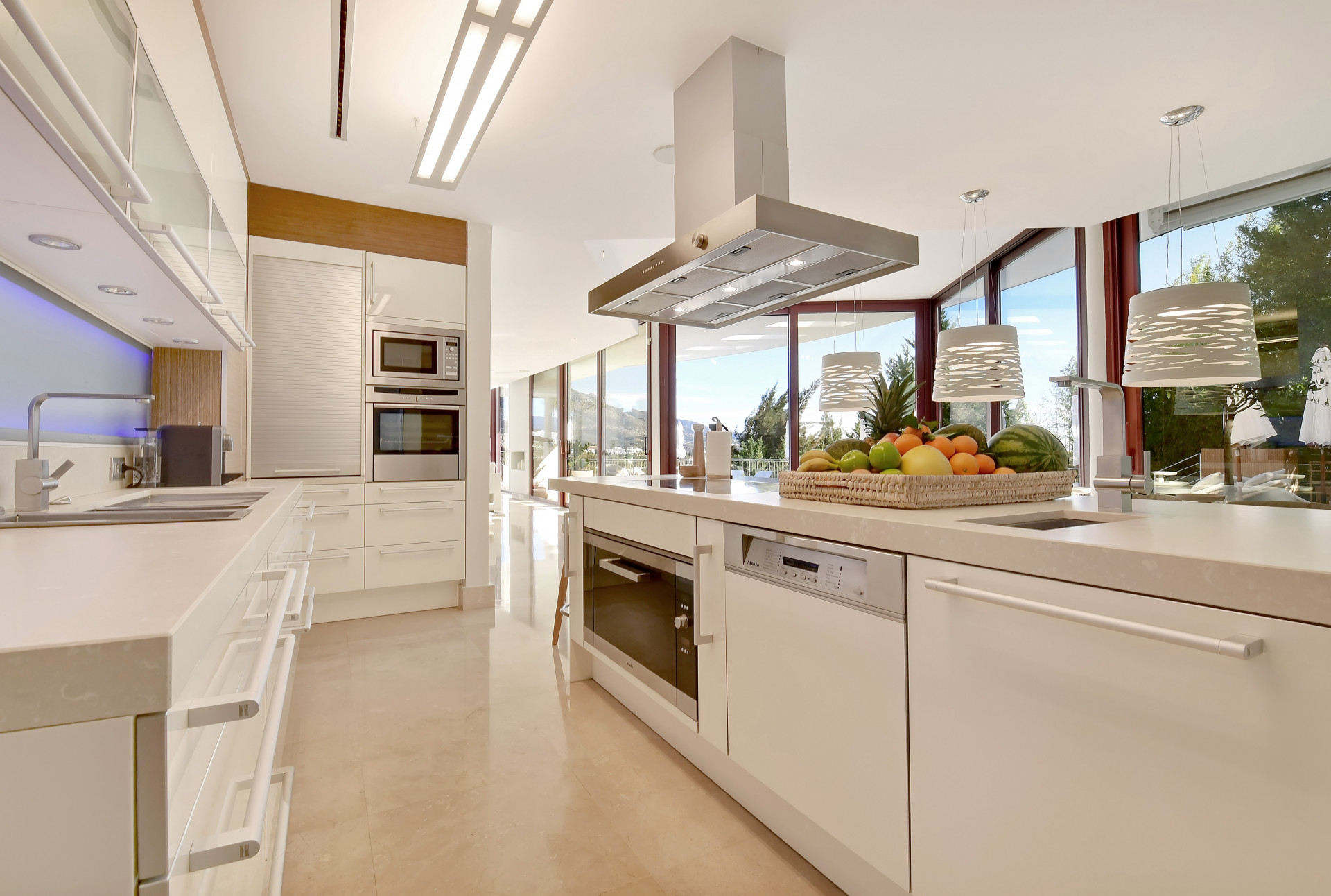 Sleek kitchen view showcasing appliances and vibrant decor.