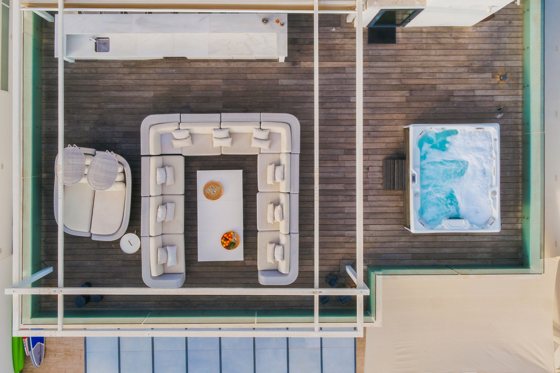 Aerial view of outdoor lounge area and hot tub.