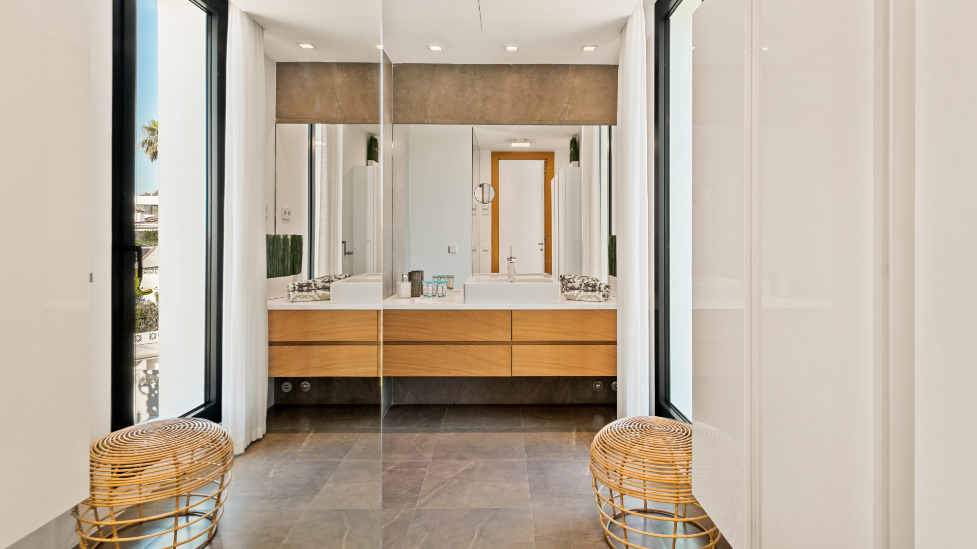 Spacious bathroom with dual sinks and contemporary design elements.