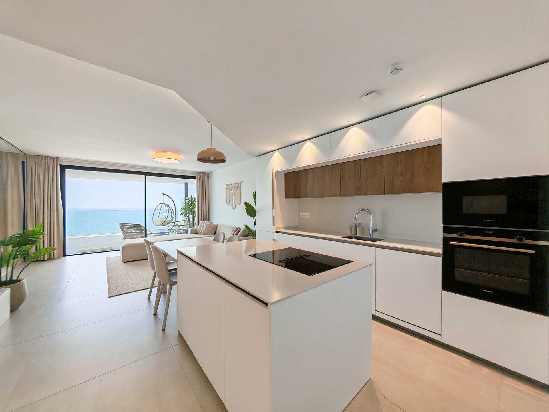 Contemporary apartment for sale in El Higueron, Fuengirola with panoramic sea views and resort-style amenities