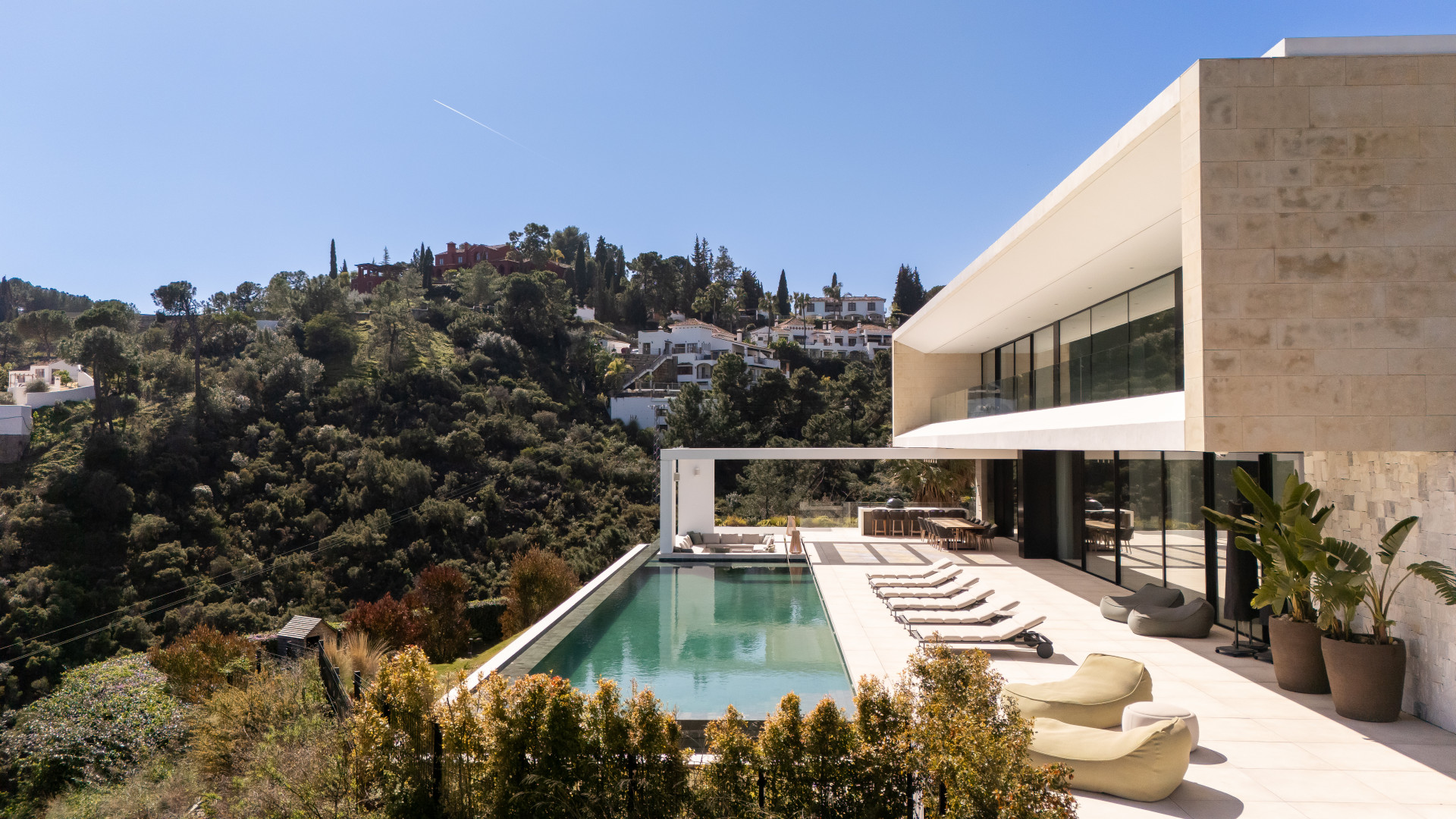 Casa De Canto is an exceptional seven-bedroom contemporary estate, in prestigious gated community of El Madroñal.