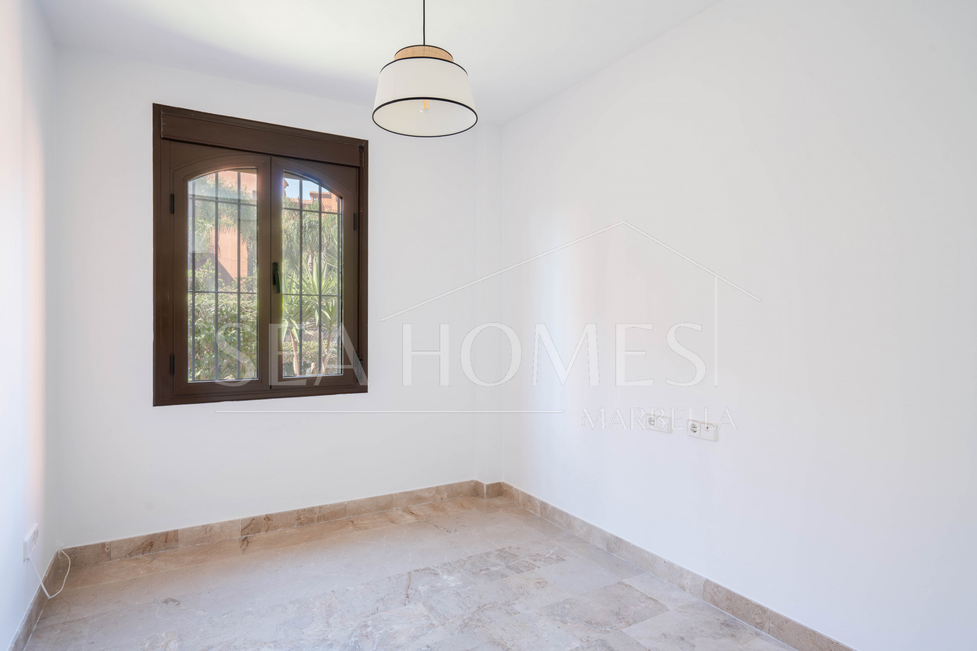 Elegant Coastal Living in Estepona – Corner Garden Apartment with Style & Serenity in Costa Galera