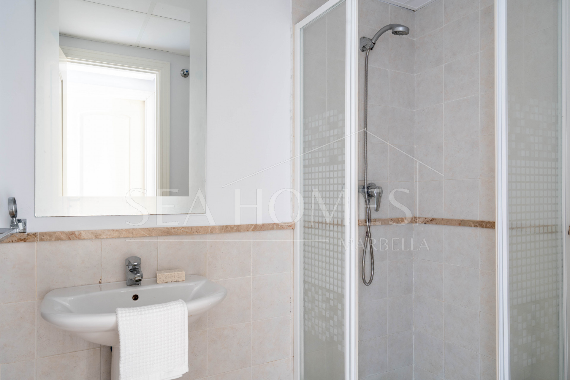 Elegant Coastal Living in Estepona – Corner Garden Apartment with Style & Serenity in Costa Galera