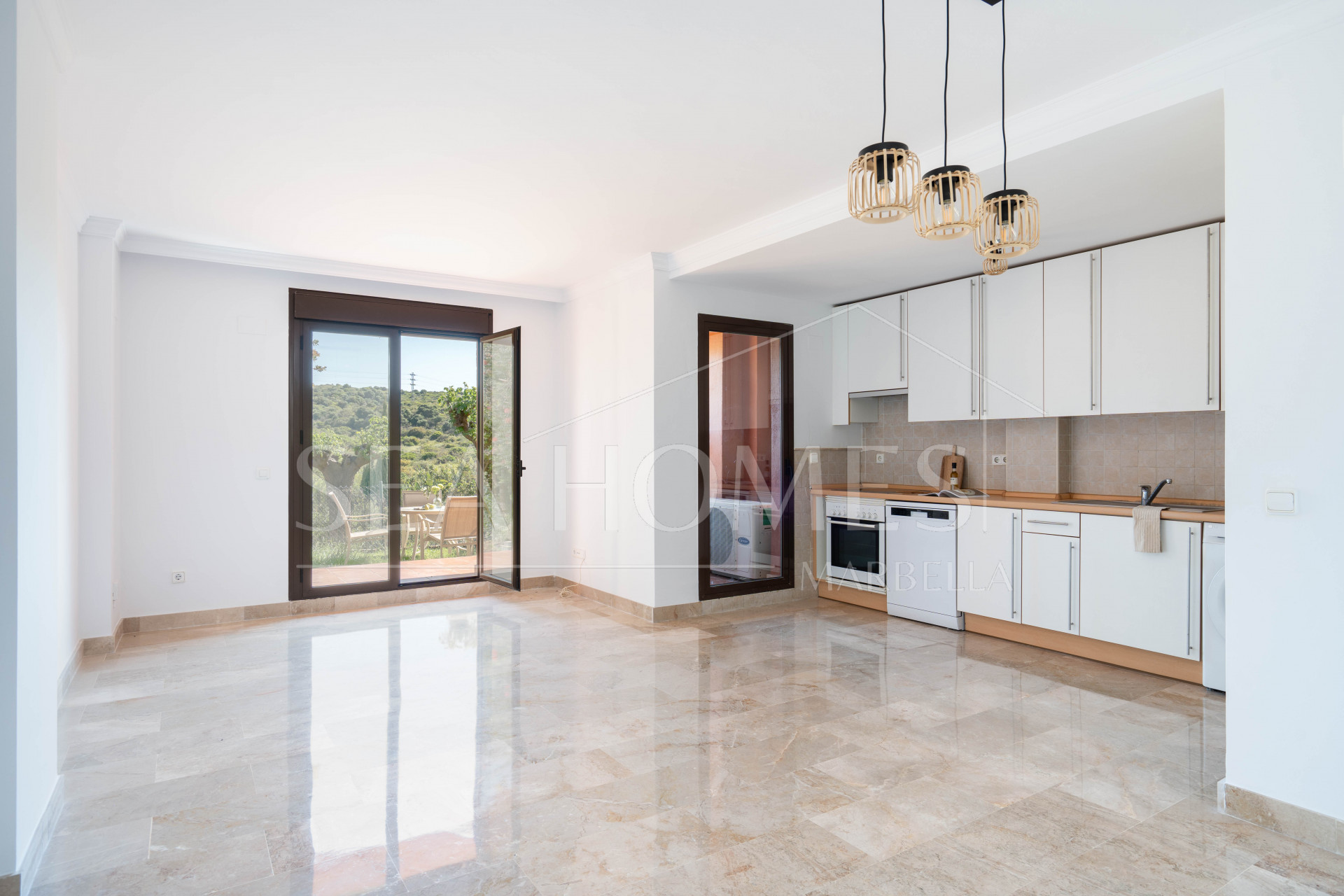 Elegant Coastal Living in Estepona – Corner Garden Apartment with Style & Serenity in Costa Galera