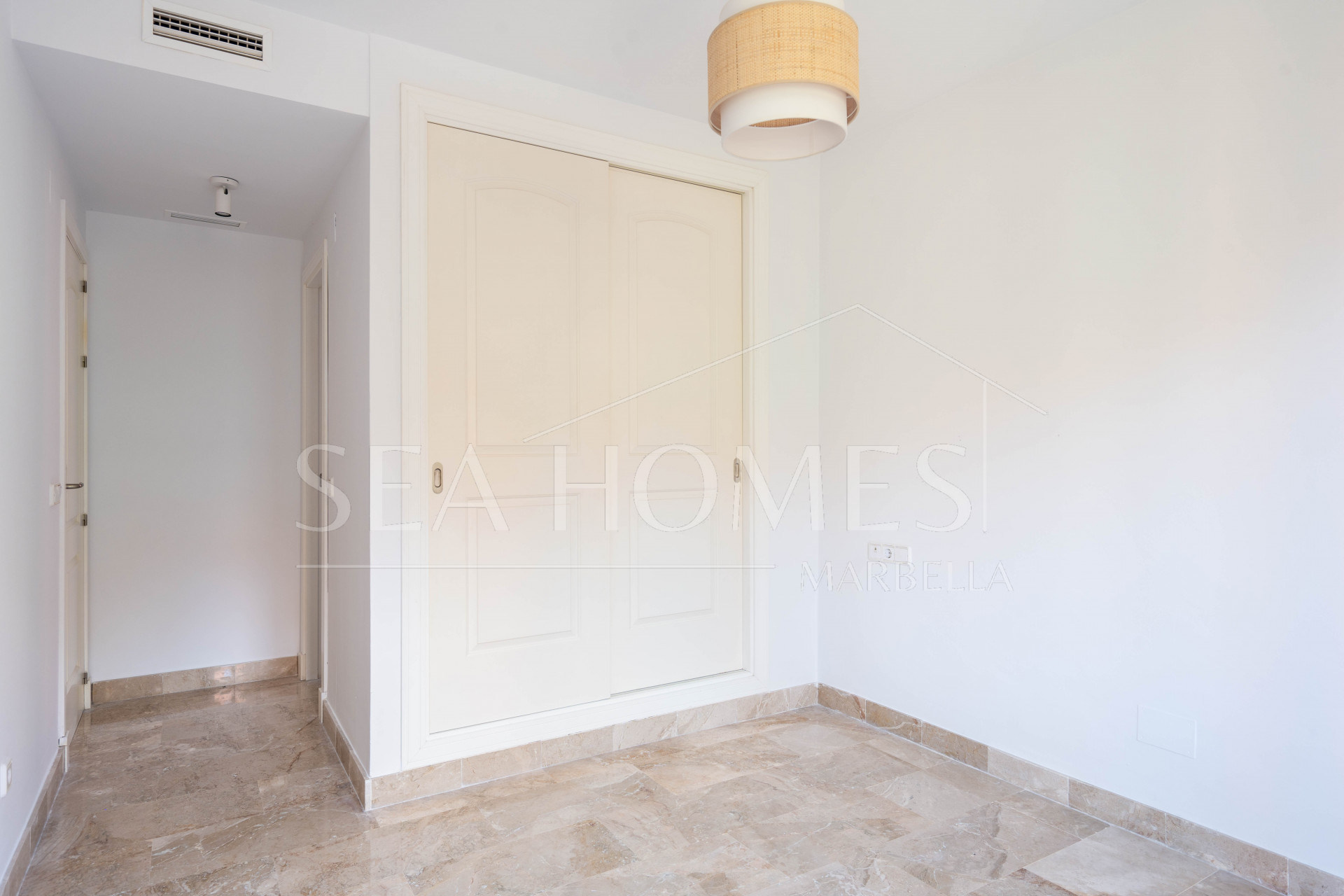 Elegant Coastal Living in Estepona – Corner Garden Apartment with Style & Serenity in Costa Galera