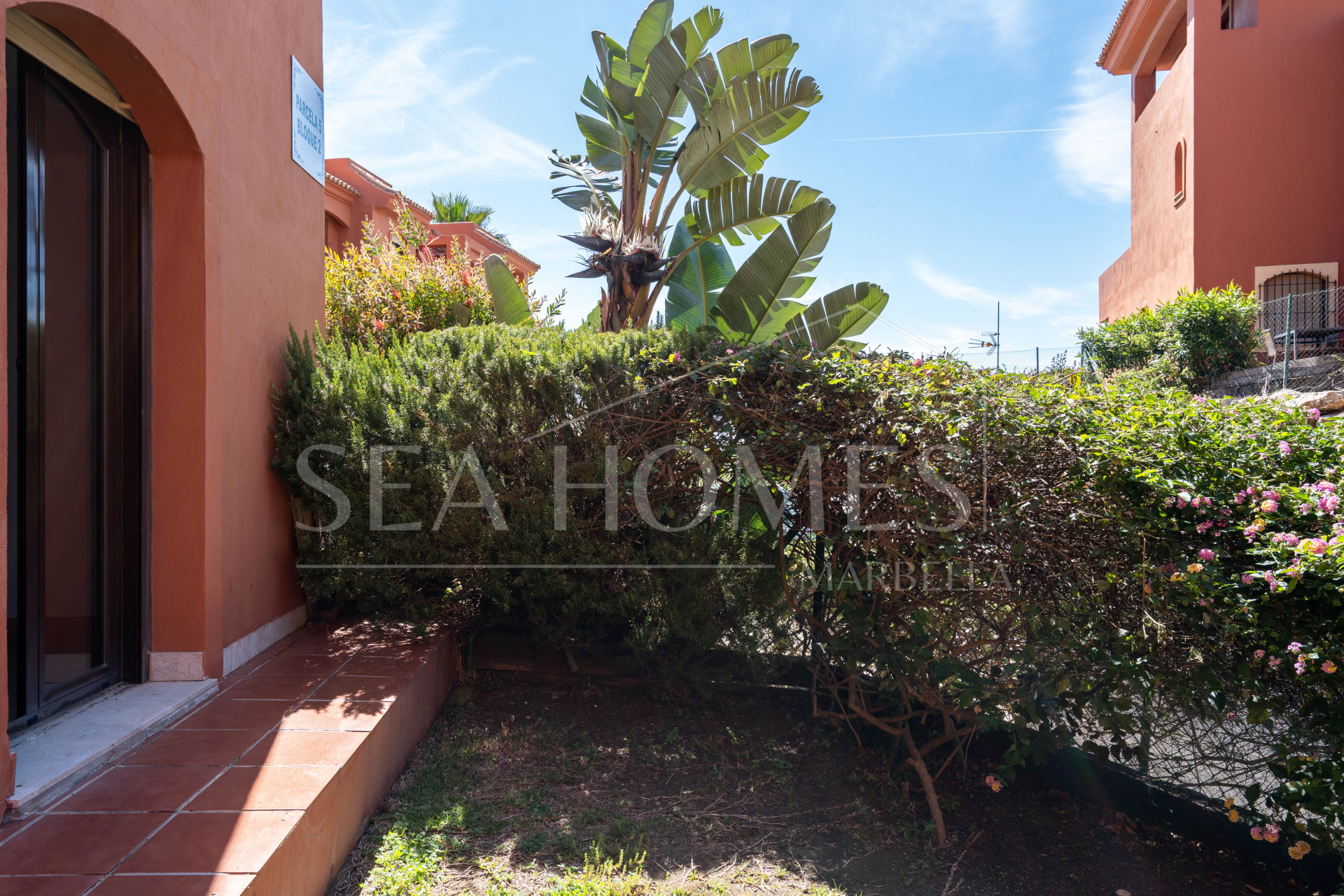 Elegant Coastal Living in Estepona – Corner Garden Apartment with Style & Serenity in Costa Galera