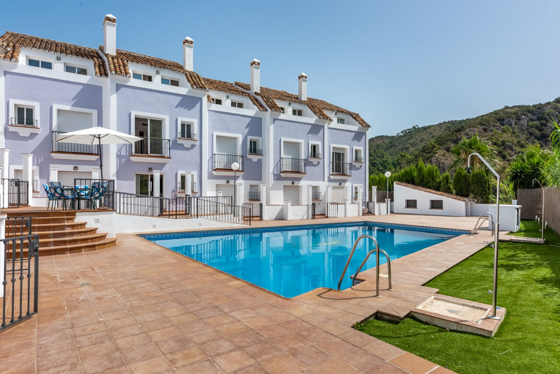 Modern Andalusian style townhouses for sale in Benahavis downtown