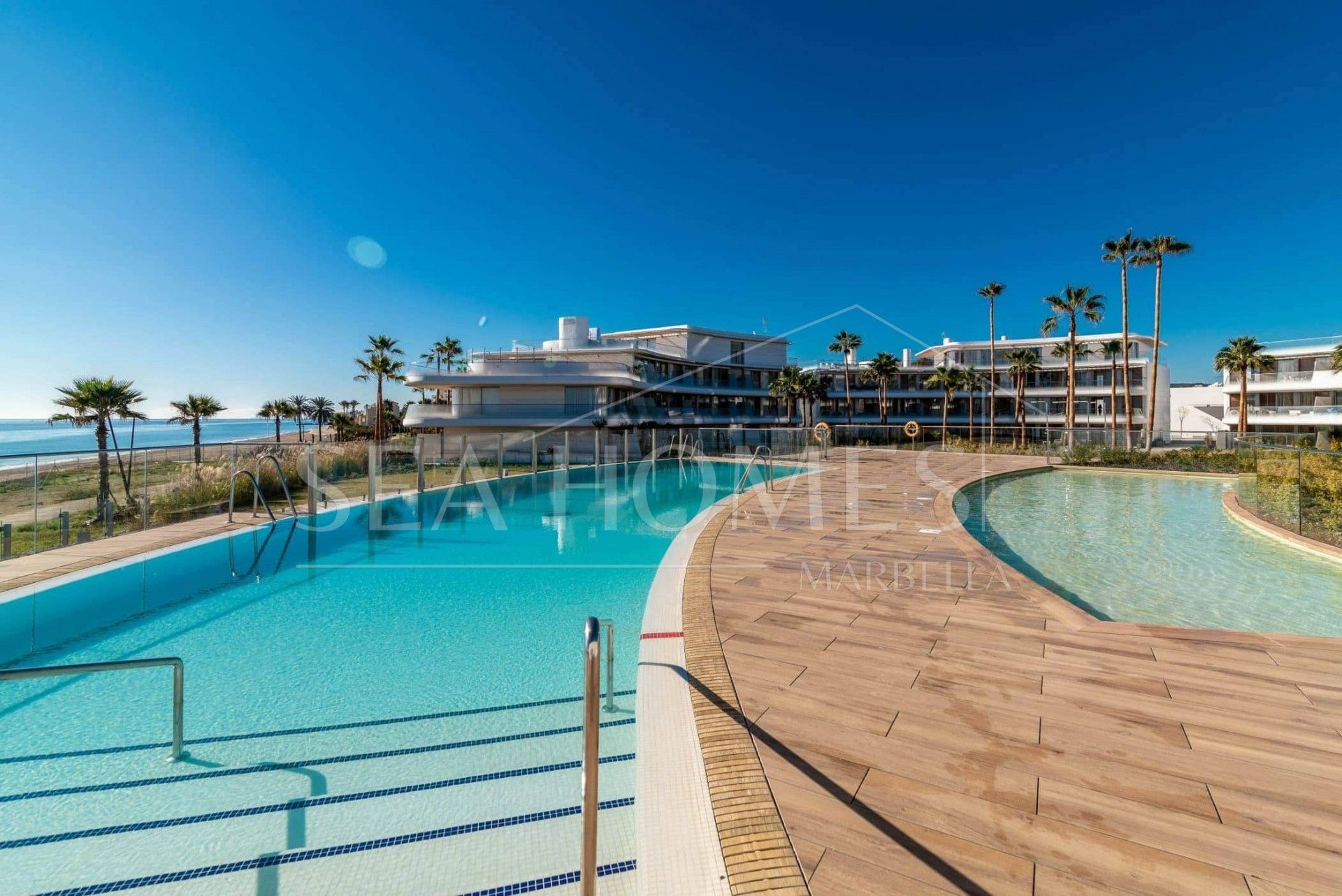 Luxurious beachfront apartment with private garden