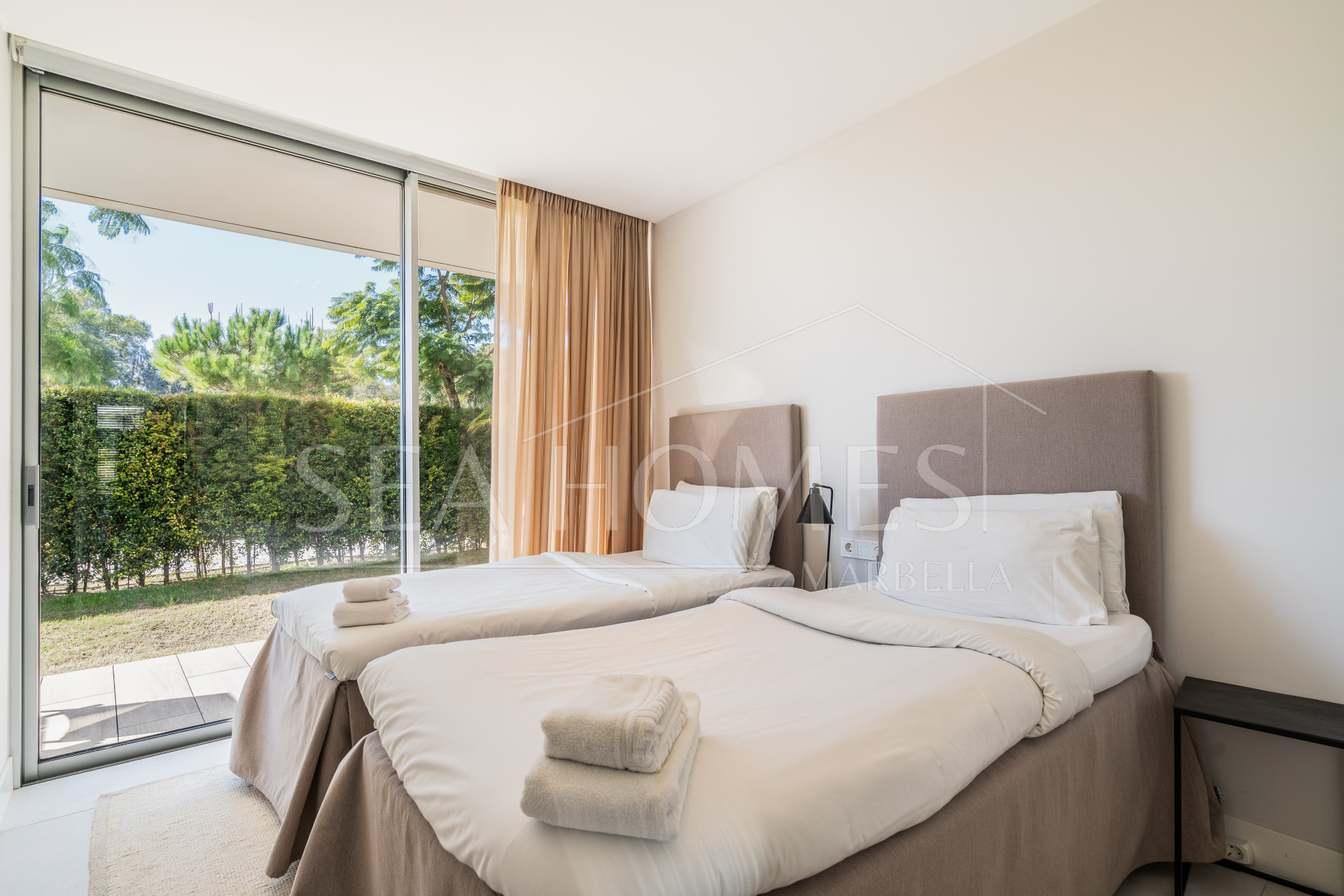 Luxurious beachfront apartment with private garden