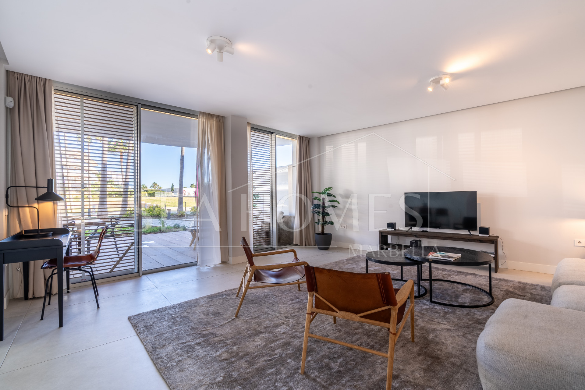 Luxurious beachfront apartment with private garden