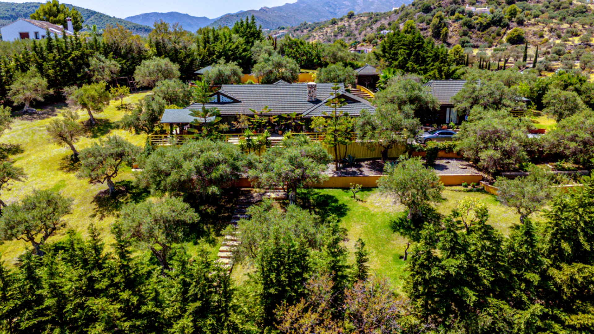 Stunning wooden country finca sits on the outskirts of Monda and its historic castle