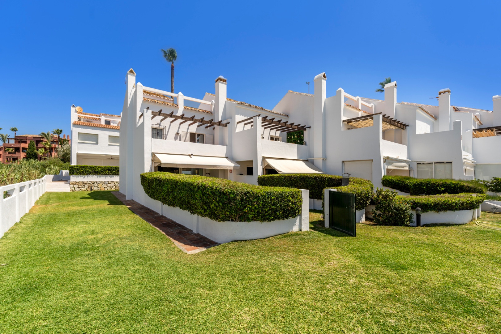 Stunning corner frontline townhouse with unobstructed views of beaches and sparkling Mediterranean