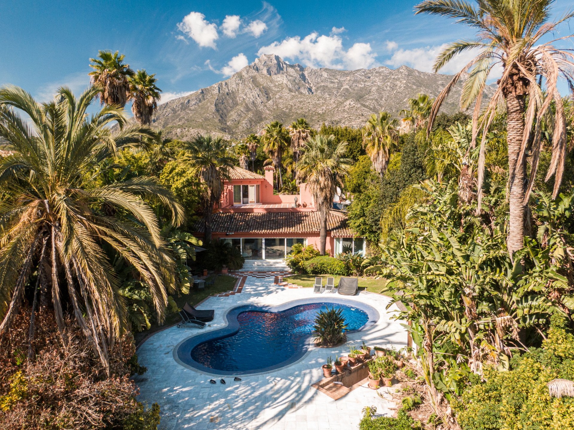 Secluded stately mansion languishes amidst subtropical gardens in the heart of Marbella.