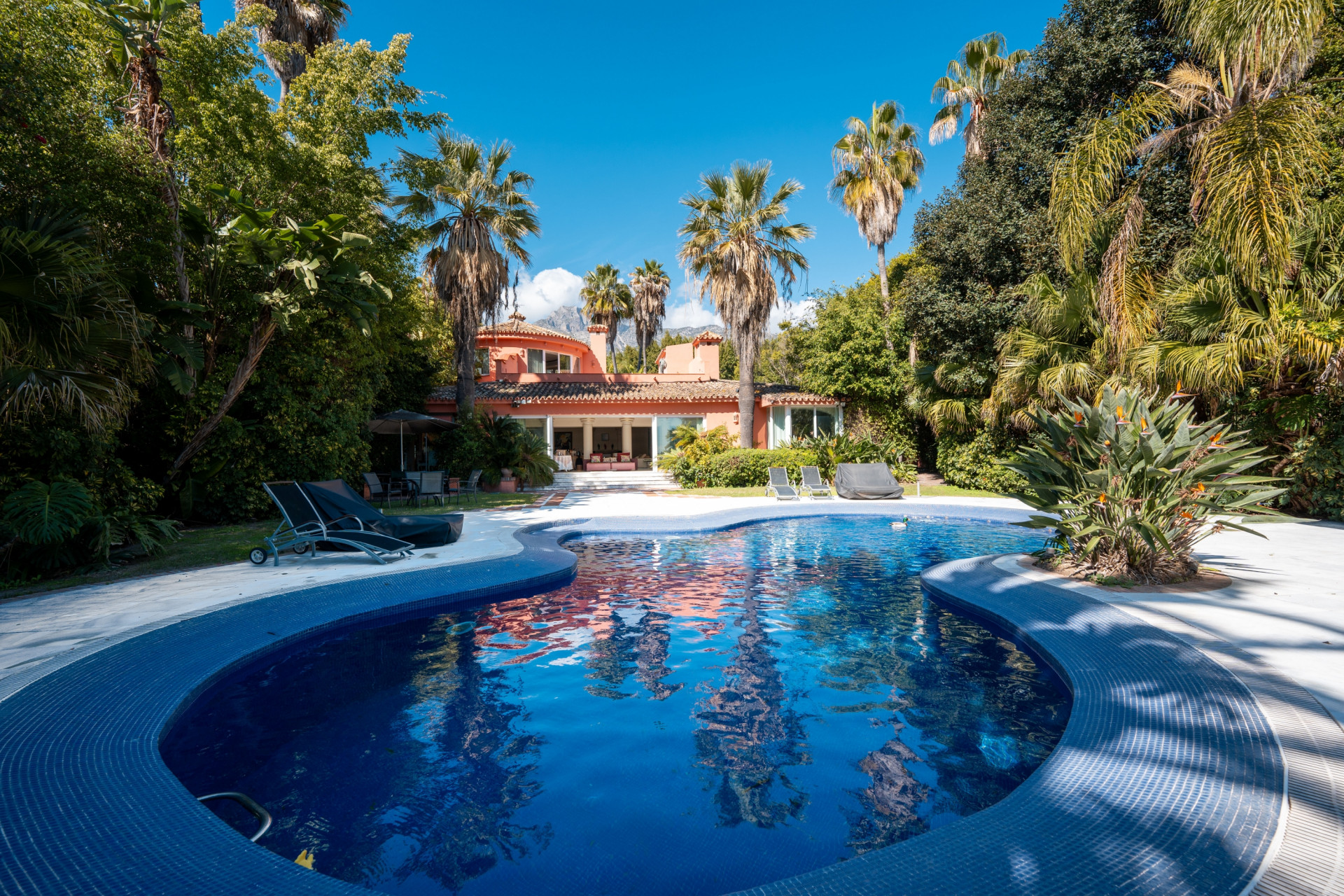 Secluded stately mansion languishes amidst subtropical gardens in the heart of Marbella.