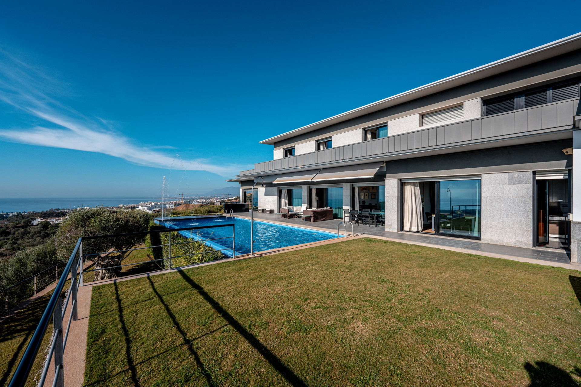 Stunning modern 5 bedroom villa perched on a hillside offering panoramic Mediterranean coastline views.