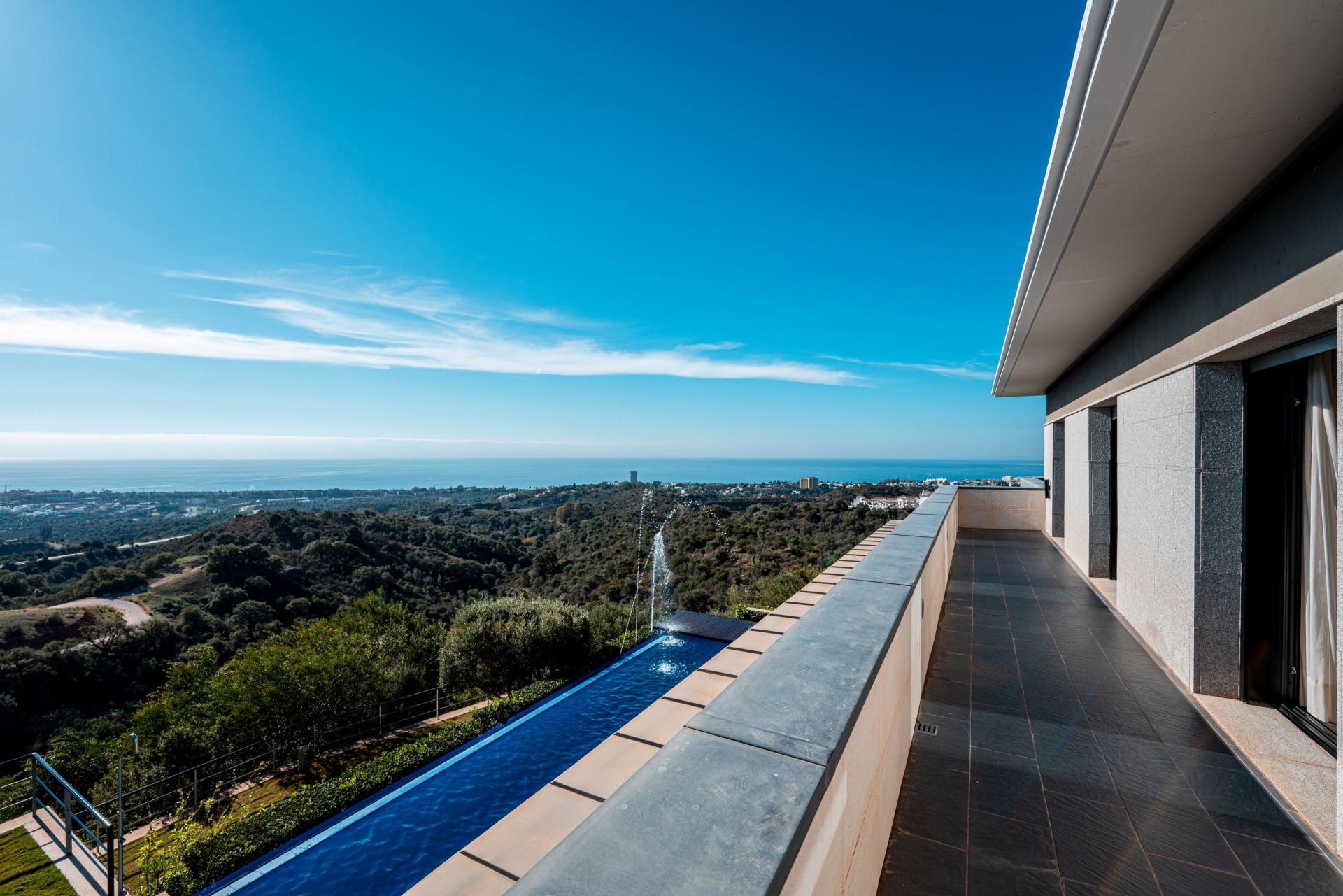 Stunning modern 5 bedroom villa perched on a hillside offering panoramic Mediterranean coastline views.