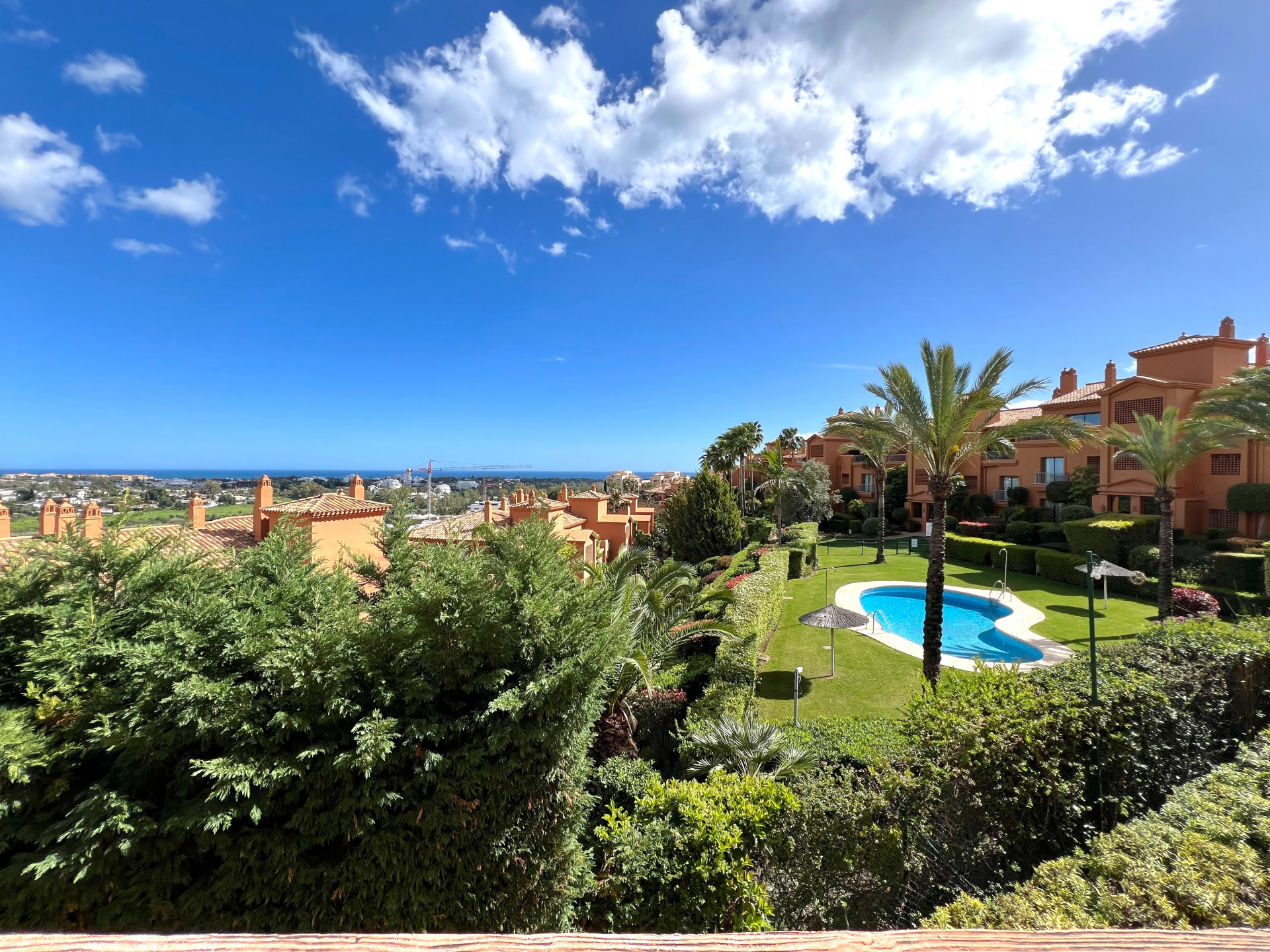 Large elevated ground floor facing southeast, enjoying beautiful views of the sea, communal gardens, and pool in Las Lomas del Conde Luque