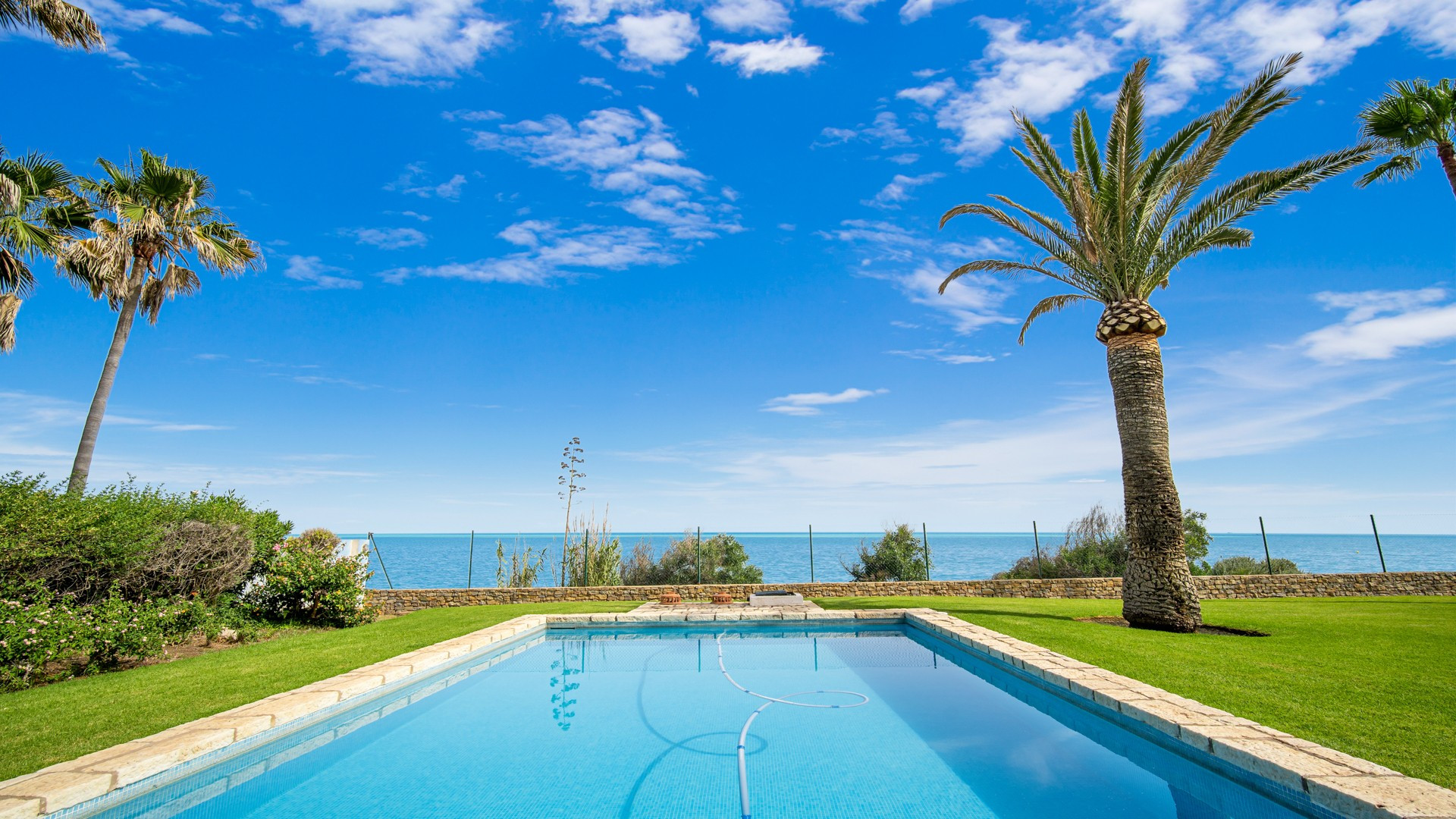 Frontline beach classical style villa with direct access to the beach and the Estepona promenade very private and quiet in a small gated community