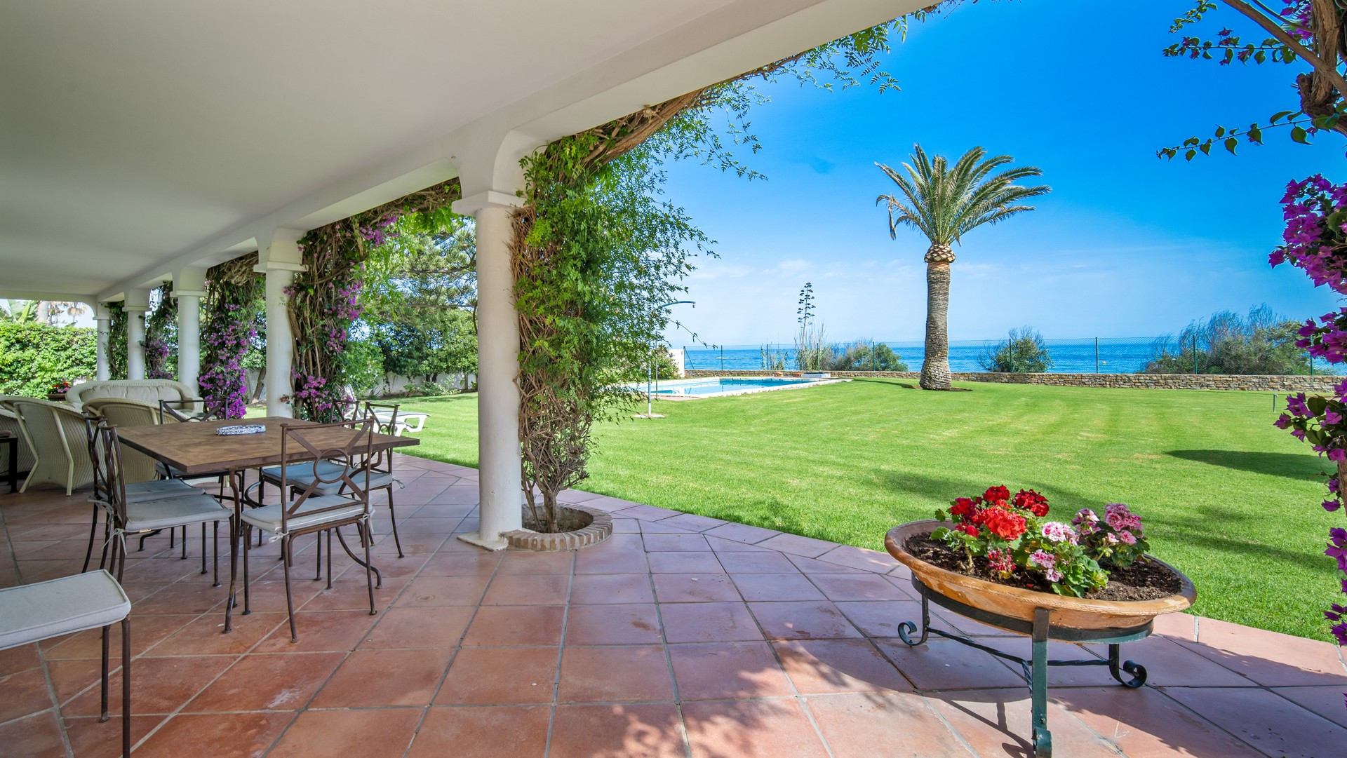 Frontline beach classical style villa with direct access to the beach and the Estepona promenade very private and quiet in a small gated community