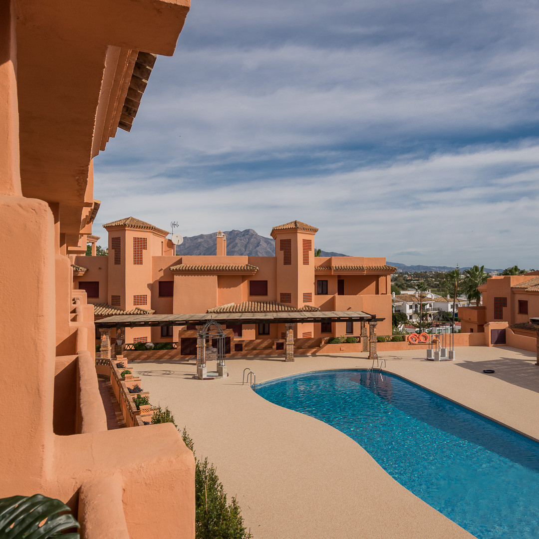 Andalusian pueblo- style one, two, and three- bedroom suites within a private resort in El Paraiso
